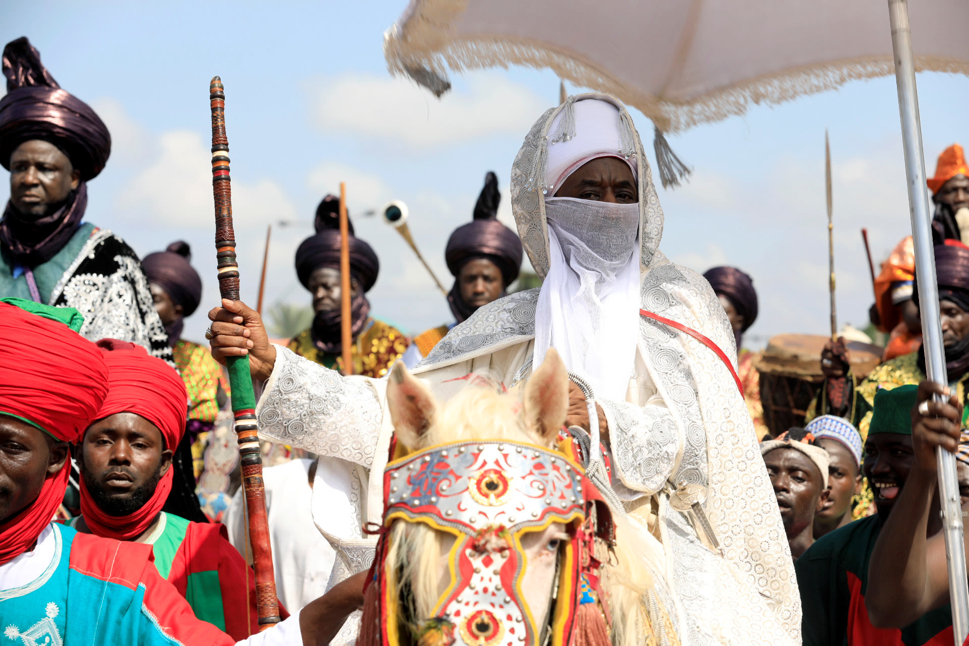 <p>Emir of Kano, Muhammad Lamido Sanusi II, rides on a dressed horse after attending prayers marking the Eid al-Adha celebration at an open field in Kofar Mata district in Nigeria’s northern city of Kano on September 1, 2017.</p>