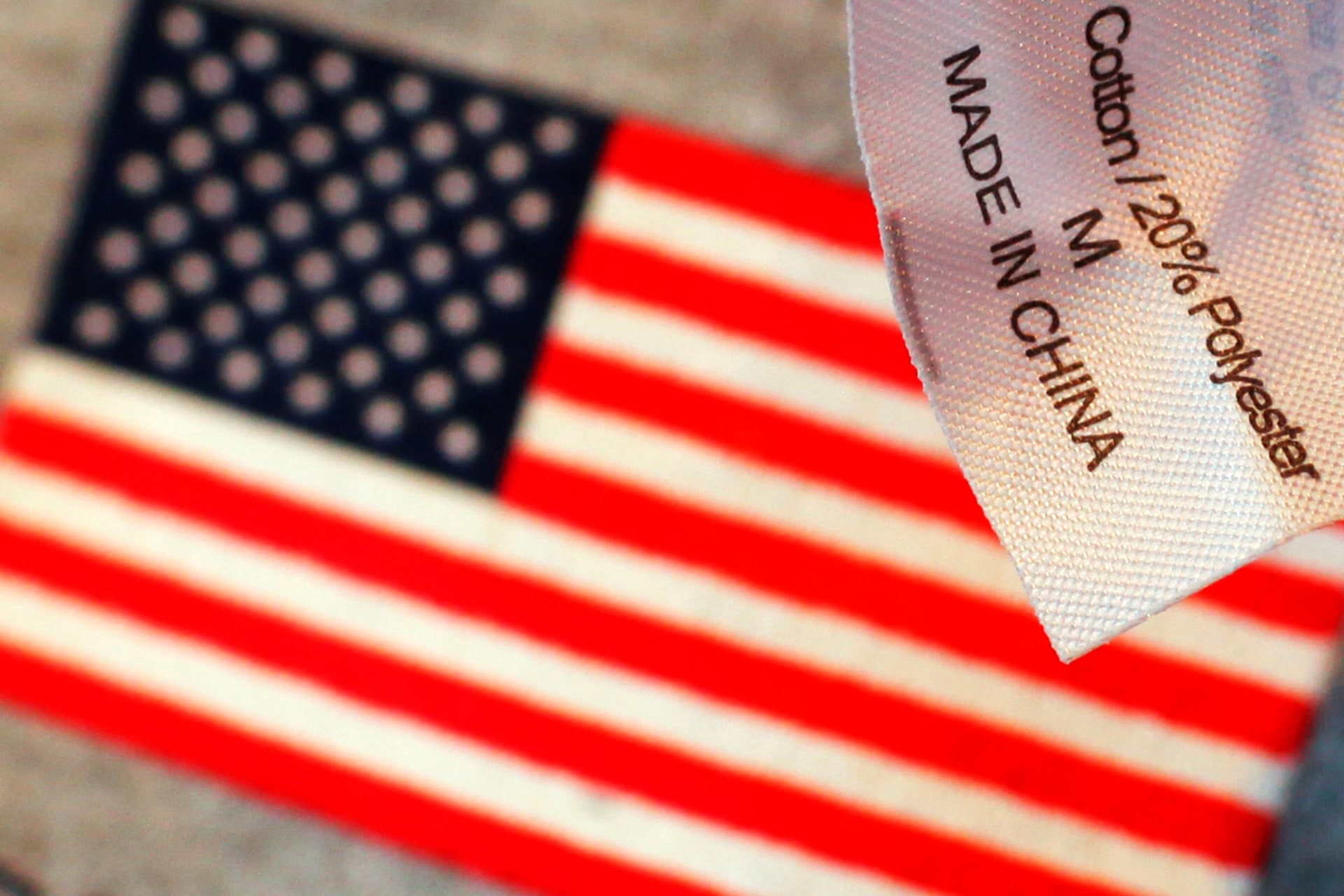 <p>Illustration of American flag and a tag that reads “Made in China.” </p>
