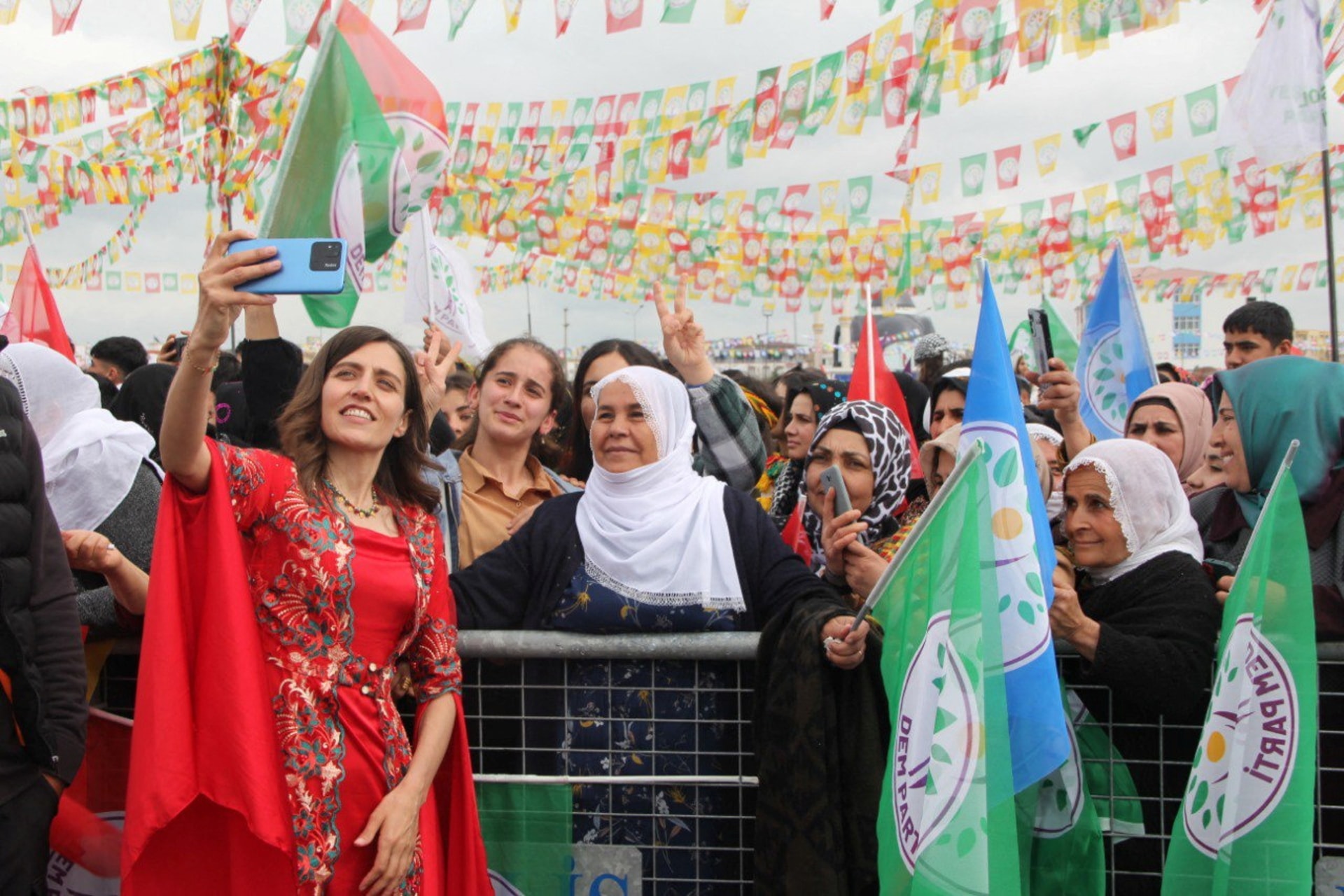 <p>Gulistan Sonuk, pro-Kurdish Peoples’ Equality and Democracy Party (DEM Party) Batman mayoral candidate, poses for a selfie with her supporters during a rally to celebrate Nowruz, which marks the arrival of spring, in Batman, Turkey March 20, 2024.</p>
