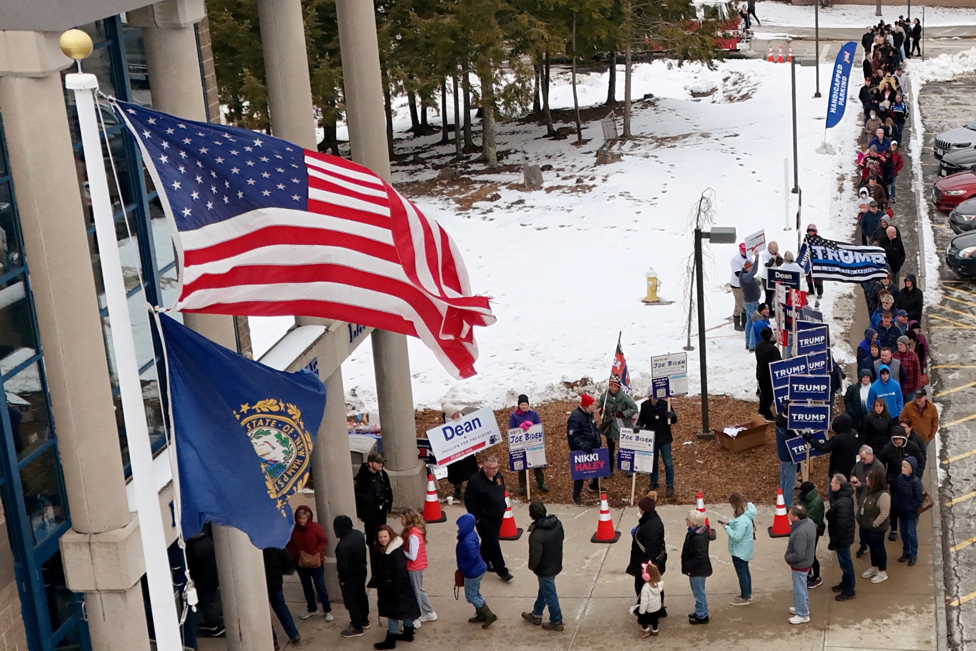 <p>Voters line up to cast their ballots in the New Hampshire presidential primary election, in Londonderry, New Hampshire on January 23, 2024</p>
