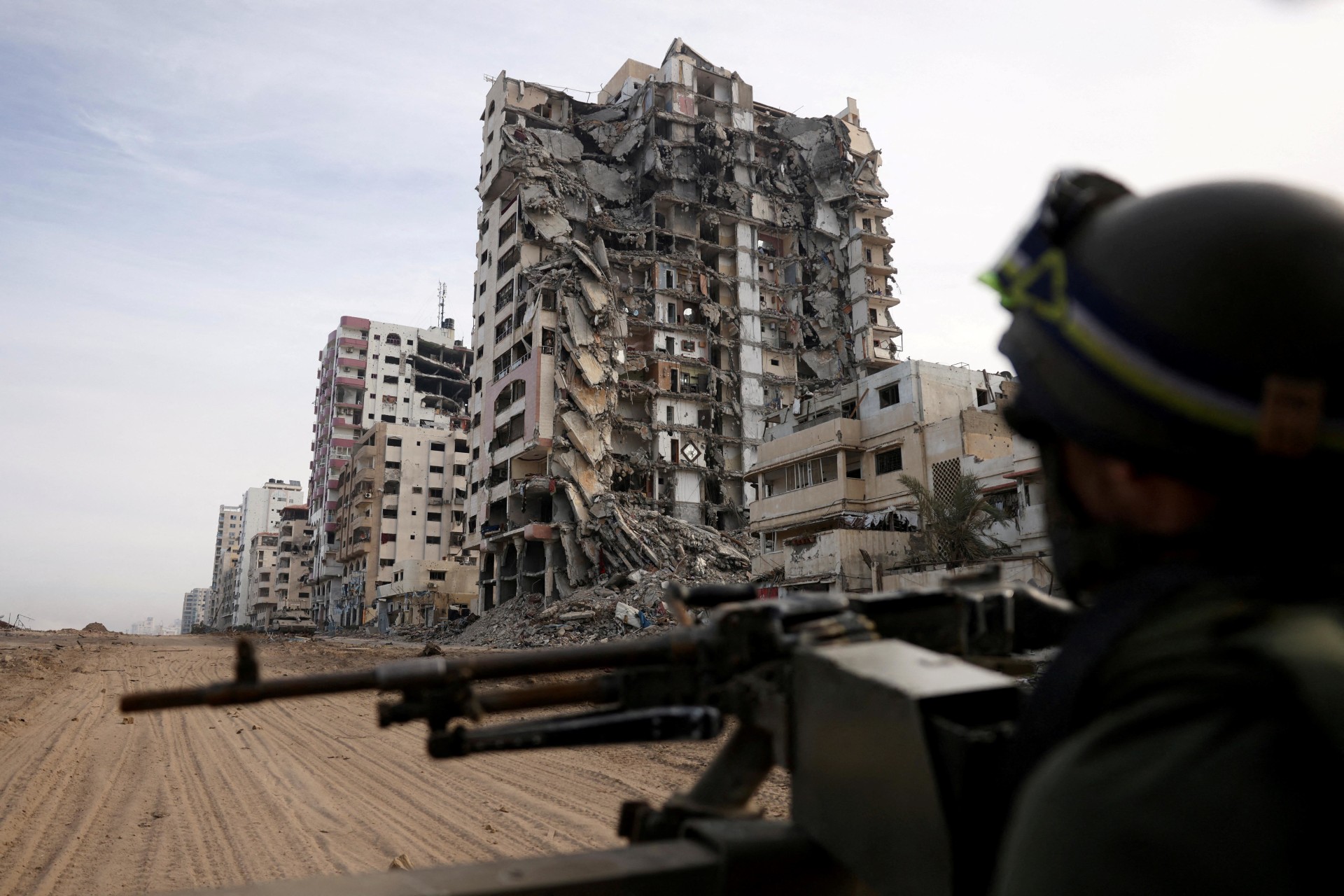 <p>An Israeli soldier sits in a Humvee amid the ongoing ground operation in northern Gaza on November 22, 2023.</p>
