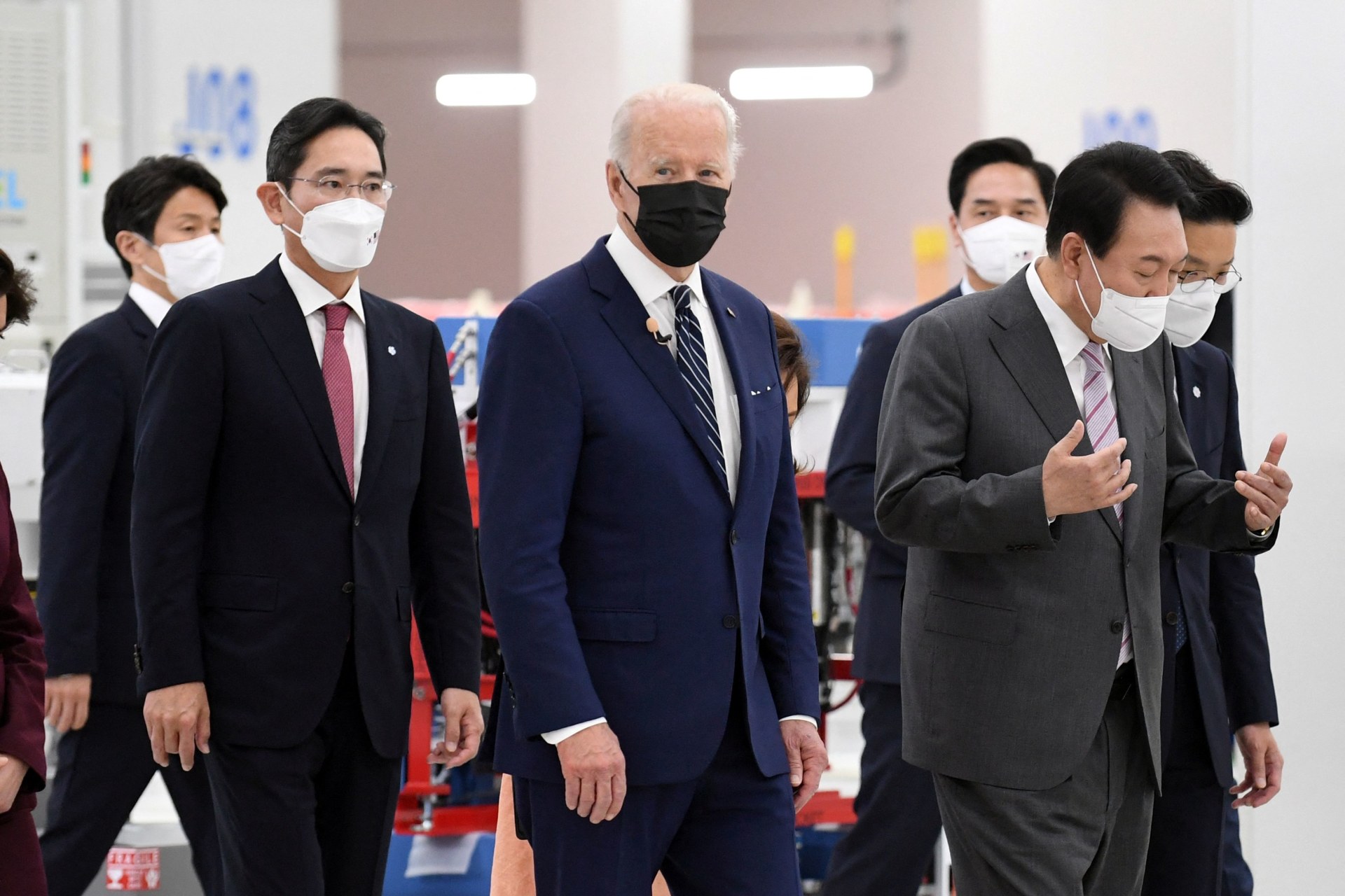 <p>U.S. President Joe Biden, South Korean President Yoon Suk Yeol, and Samsung Electronics Co. Vice Chairman Lee Jae-yong walk at the Samsung Electronic Pyeongtaek Campus in South Korea on May 20 2022.</p>