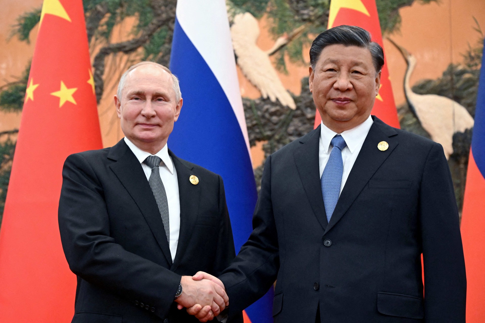 <p>Russian President Vladimir Putin shakes hands with Chinese President Xi Jinping during a meeting at the Belt and Road Forum in Beijing, China, on October 18, 2023.</p>