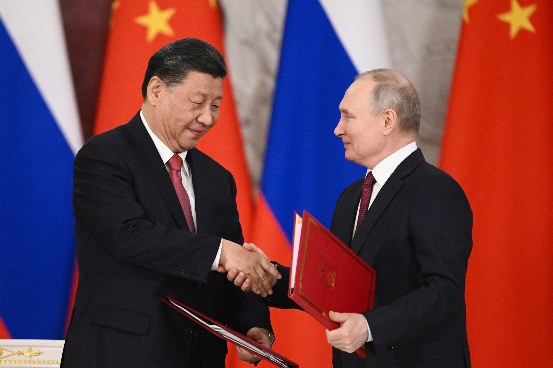 <p>Russian President Vladimir Putin and Chinese President Xi Jinping attend a signing ceremony at the Kremlin in Moscow, Russia, on March 21, 2023.</p>