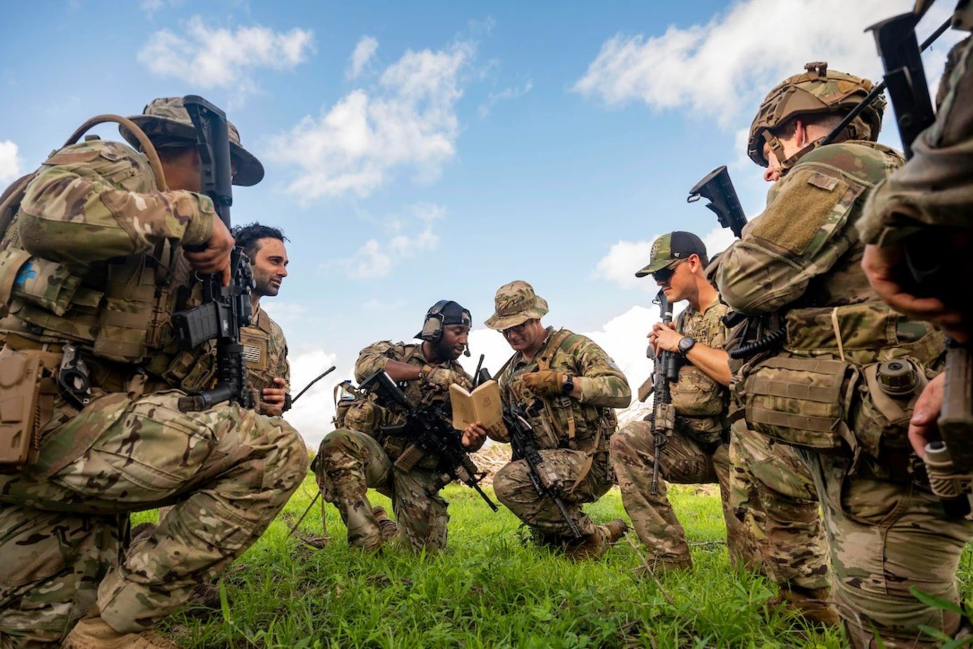 <p>Soldiers compare notes during a patrol in Manda Bay, Kenya, on May 17, 2023.</p>
