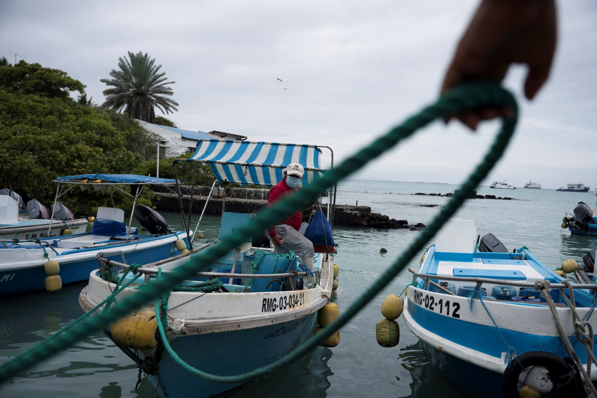 <p>A fisherman gets off his boat after Ecuador’s government expanded the protected marine area around the Galápagos Islands, in Puerto Ayora on the island of Santa Cruz, Galápagos Islands, Ecuador January 24, 2022.</p>
