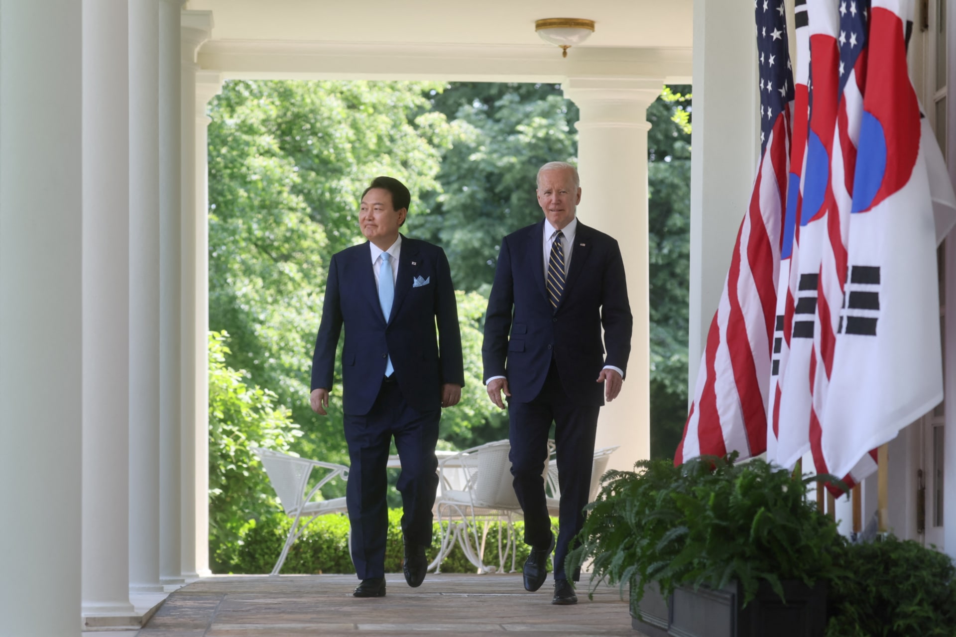 <p>U.S. President Joe Biden and South Korea’s President Yoon Suk Yeol exit the Oval Office and walk up the West Wing colonnade to the Rose Garden to hold a joint news conference at the White House on April 26, 2023.</p>

