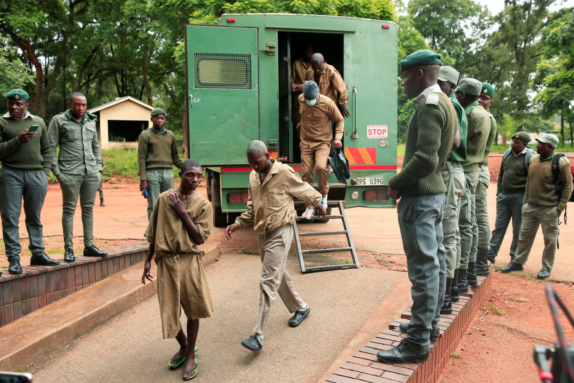 <p>Members of the opposition party Citizens Coalition for Change arrive at the Magistrates court after being arrested on charges of unlawful gatherings and inciting violence in Harare, Zimbabwe on January 17, 2023.</p>