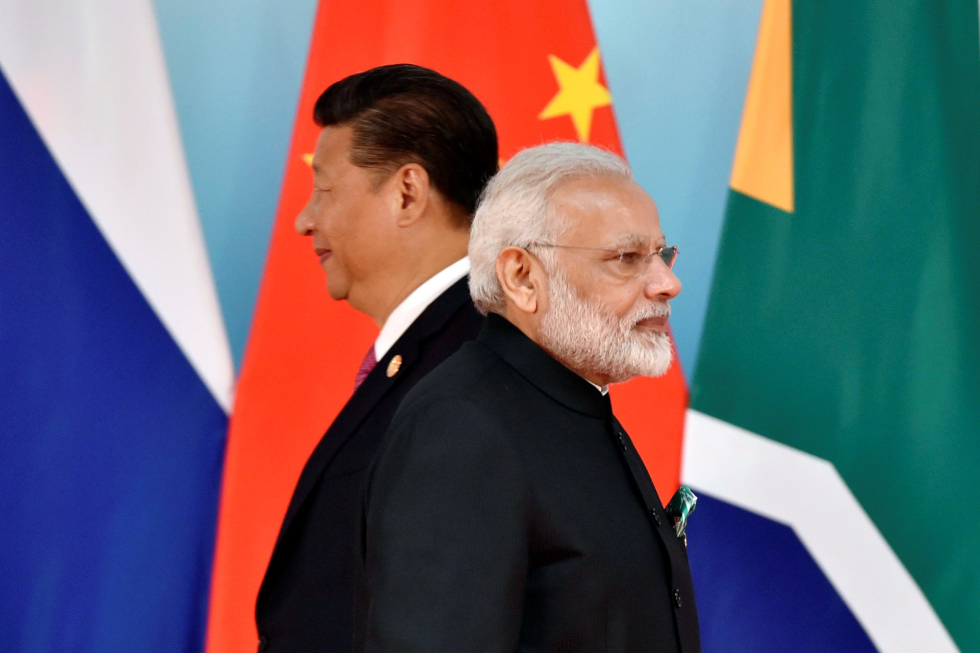 <p>Chinese President Xi Jinping (L) and Indian Prime Minister Narendra Modi attend the group photo session during the BRICS Summit at the Xiamen International Conference and Exhibition Center in Xiamen, China, on September 4, 2017.</p>
