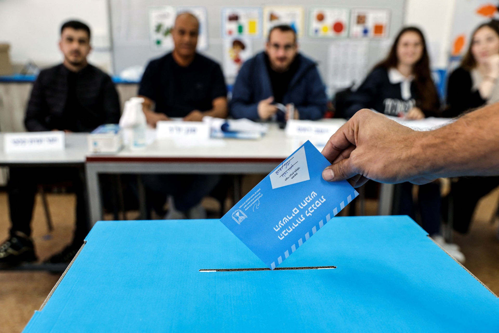 <p>An Israeli man casting his ballot on the day of Israel’s general election in a polling station in Rahat, Israel</p>