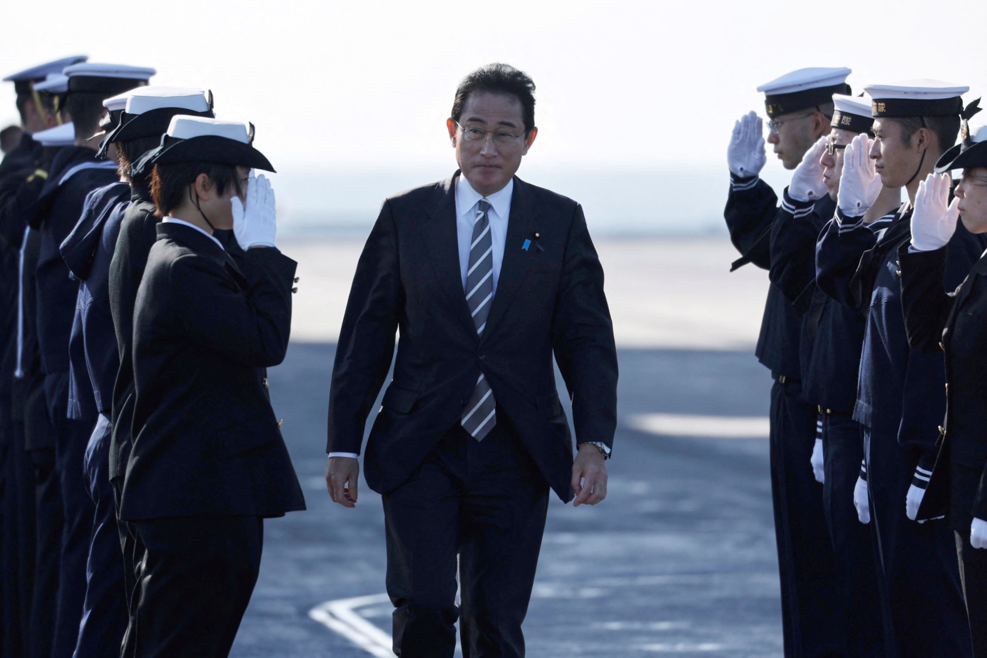 <p>Japan’s Prime Minister Fumio Kishida receives salutes from Japan Maritime Self-Defence Force (JMSDF) soldiers during the International Fleet Review to commemorate the 70th anniversary of the foundation of the JMSDF, at Sagami Bay.</p>
