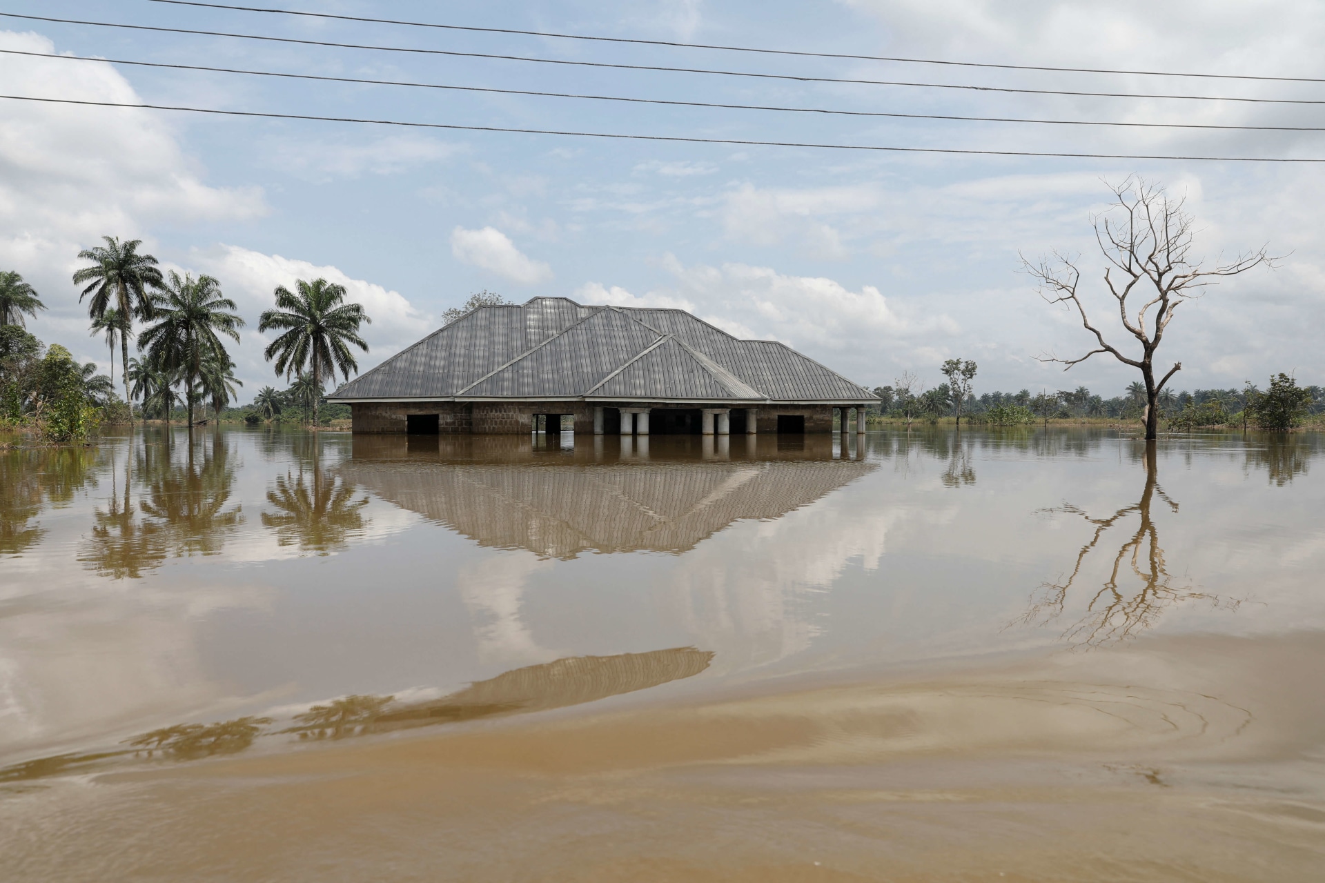 <p>A building submerged in water is pictured, following a massive flood in Obagi community, Rivers state, Nigeria on October 22, 2022. </p>
