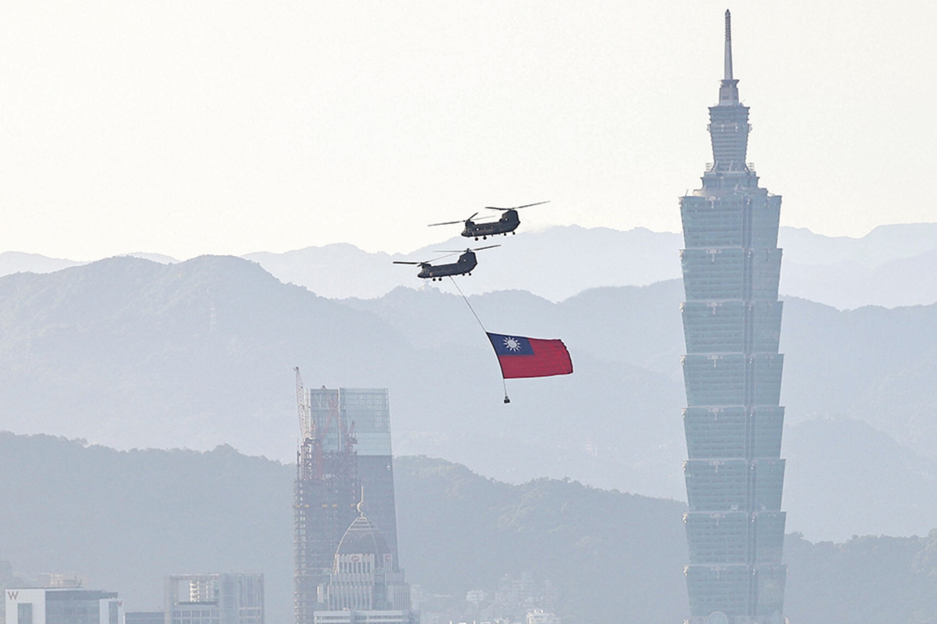 <p>A CH-47 flies across Taipei during a rehearsal ahead of National Day celebrations</p>
