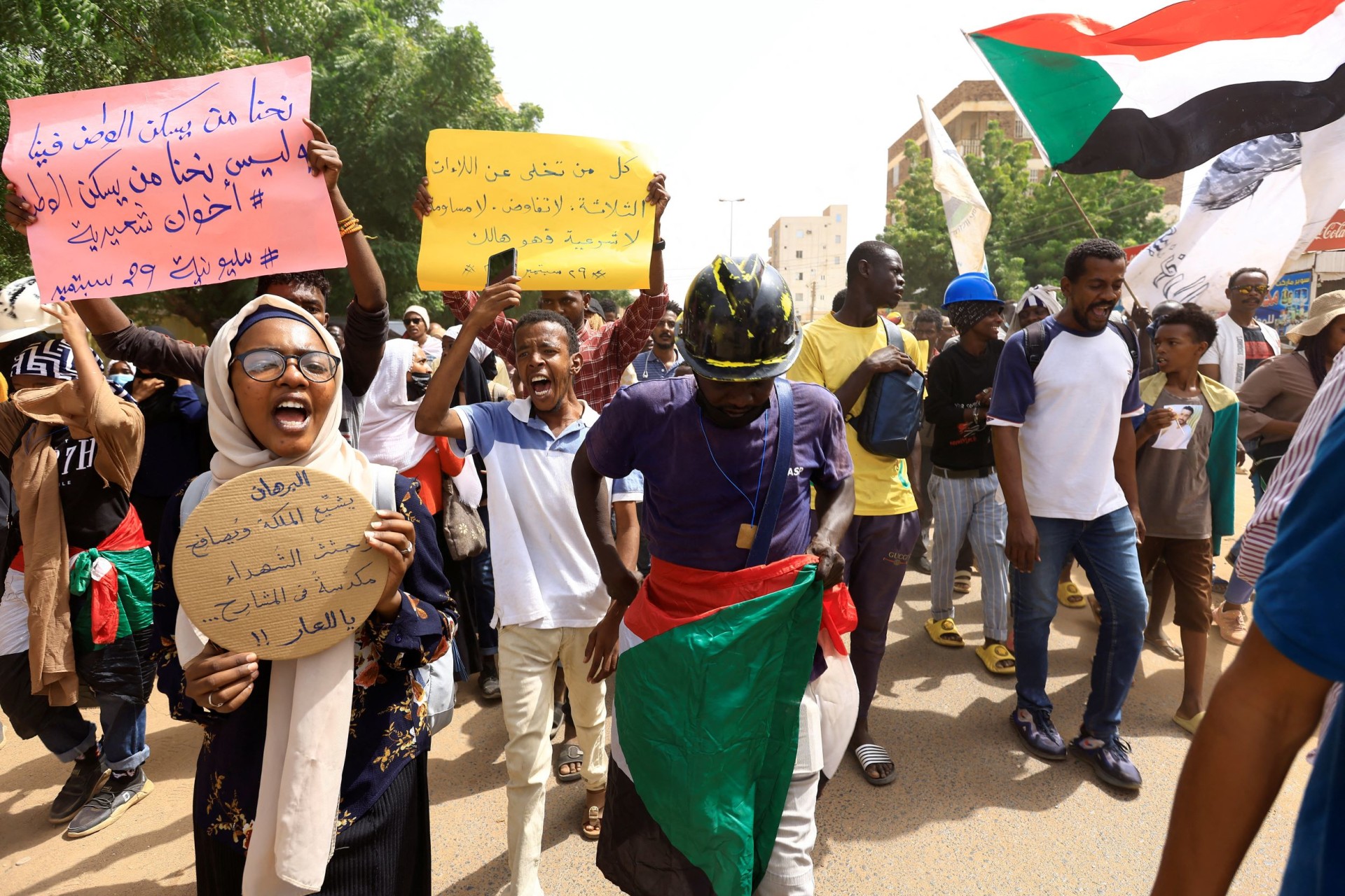 <p>Protesters march during a rally against military rule following the last coup, in Khartoum, Sudan, on September 29, 2022.</p>