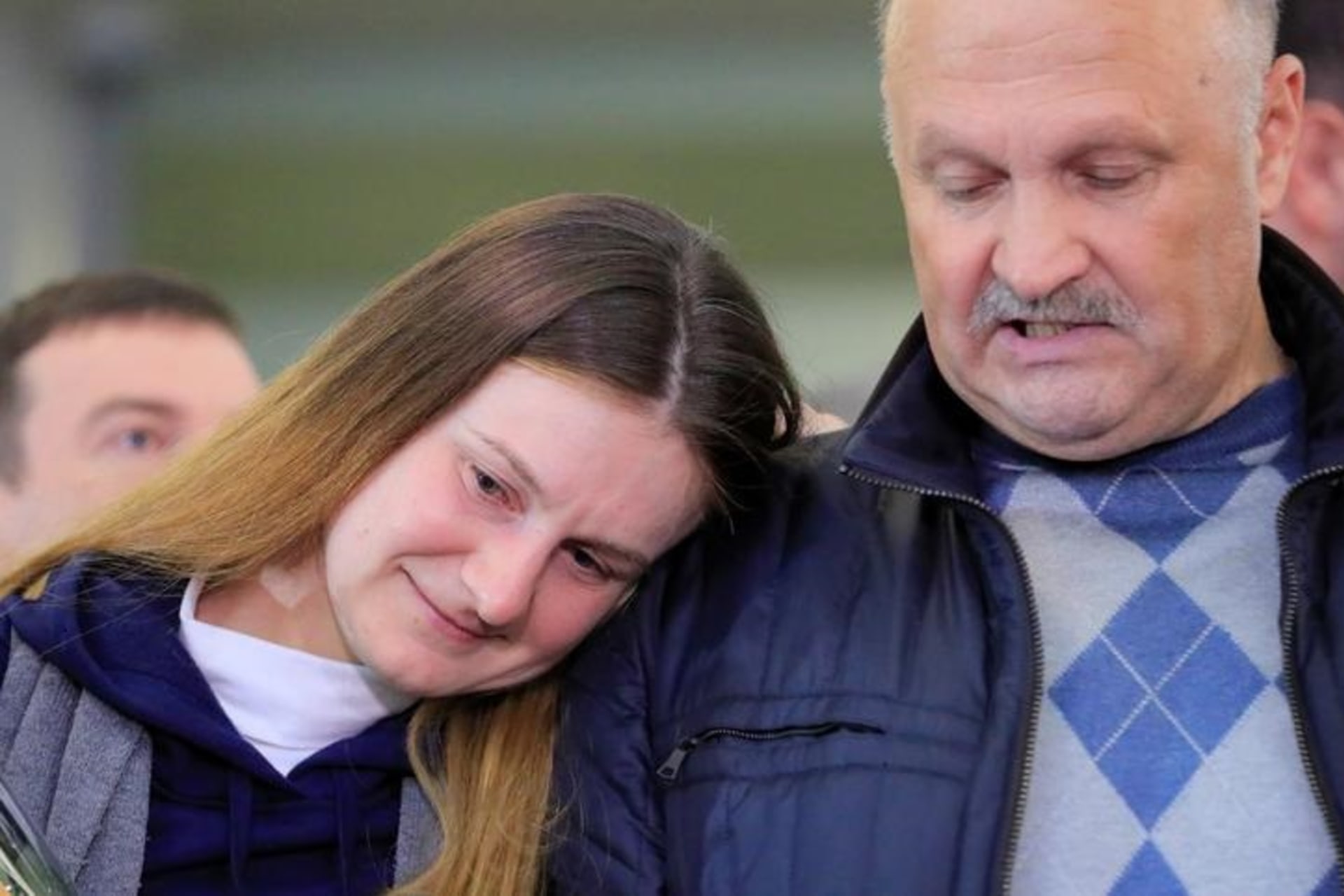 <p>Convicted Russian agent Maria Butina leans on the shoulder of her father, Valery Butin, at Sheremetyevo International Airport after Butina’s release from U.S. custody</p>
