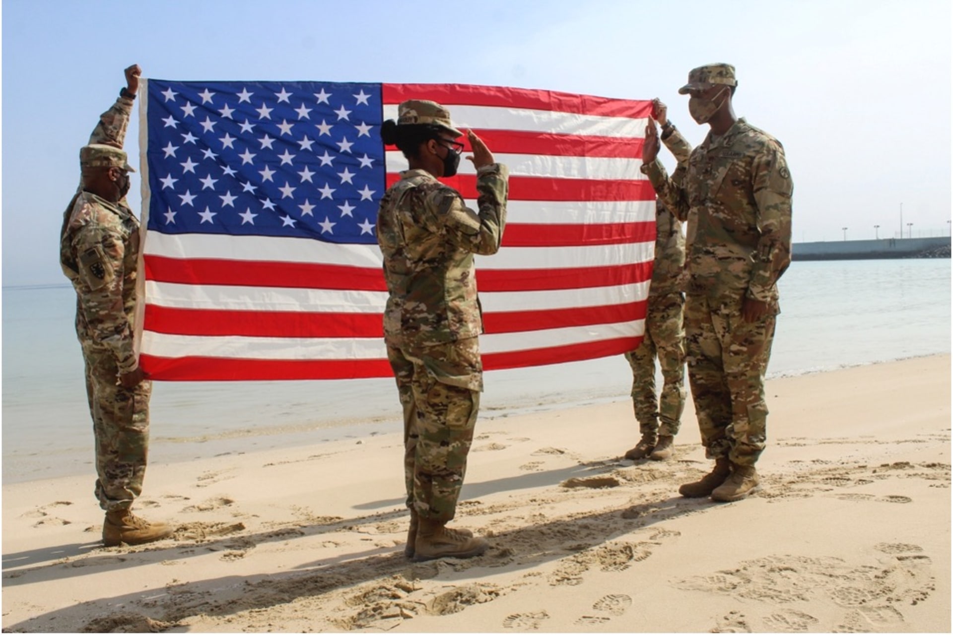 <p>Army Captain Tiara Tompkins-Bradley reaffirms Sergeant Ricky N. Paige’s oath of enlistment at Kuwait Naval Base on February 4, 2021.</p>
