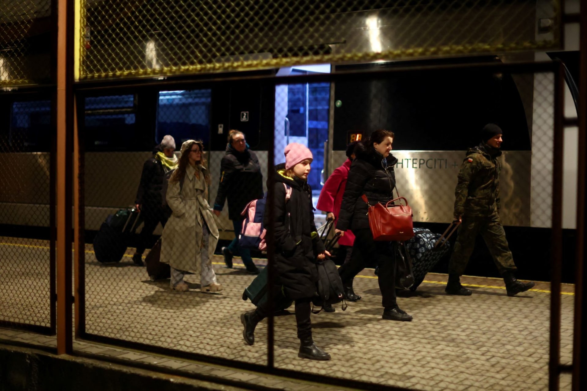 <p>Ukrainian refugees disembark a train from Ukraine at Przemysl Glowny train station, after fleeing the Russian invasion of Ukraine, in Przemysl, Poland on April 3, 2022.</p>
