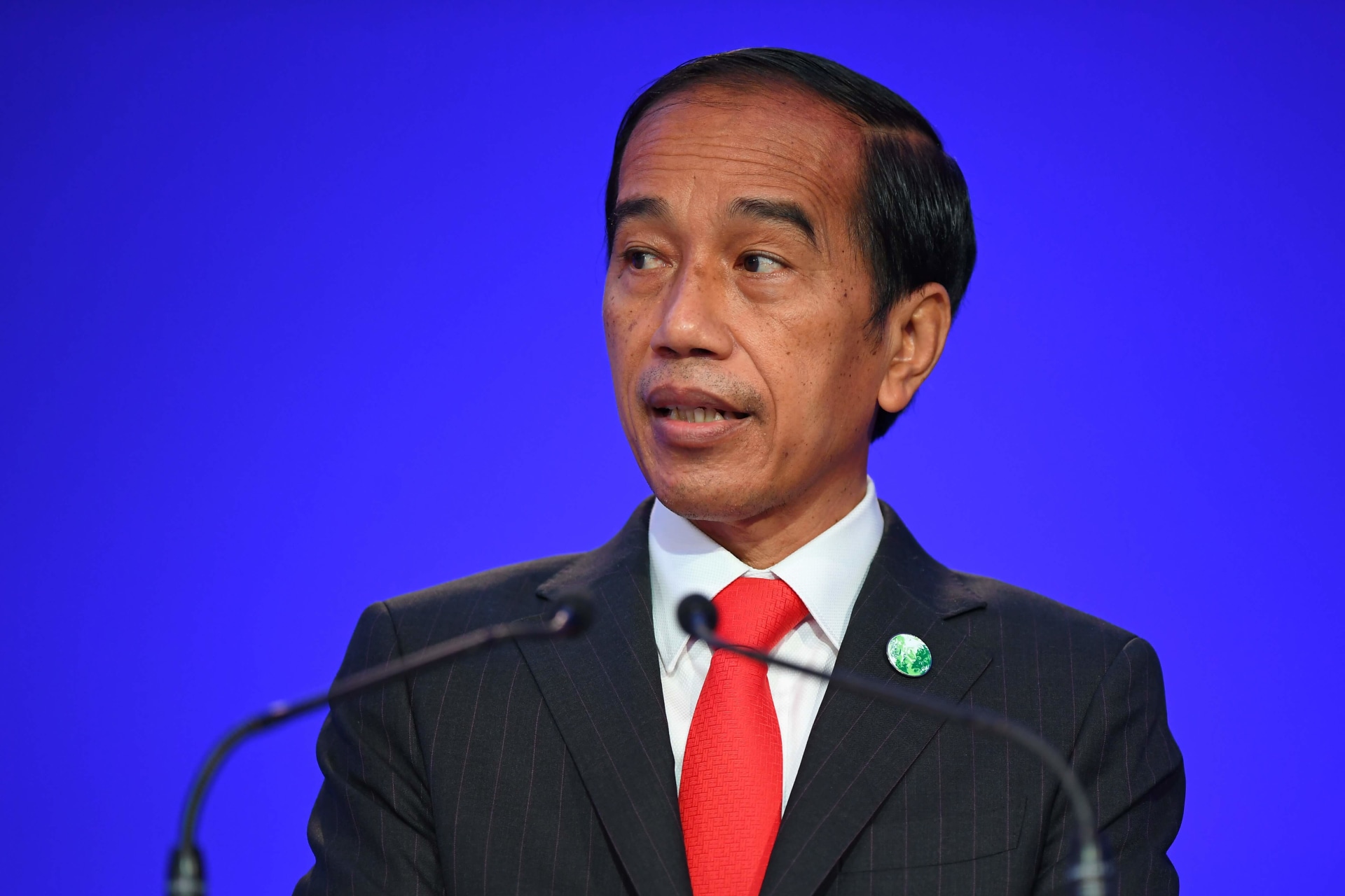 <p>Indonesia’s President Joko Widodo presents his national statement as a part of the World Leaders’ Summit at the UN Climate Change Conference (COP26) in Glasgow, Scotland, on November 1, 2021.</p>