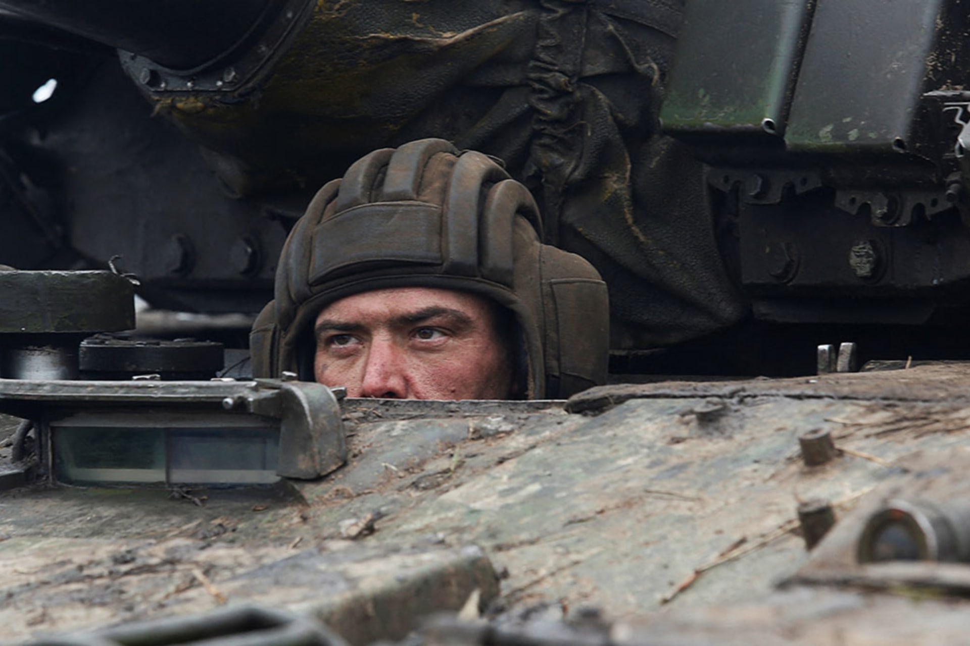 <p>A serviceman of pro-Russian militia in a tank of armed forces of the separatist self-proclaimed Luhansk People’s Republic on February 27, 2022</p>
