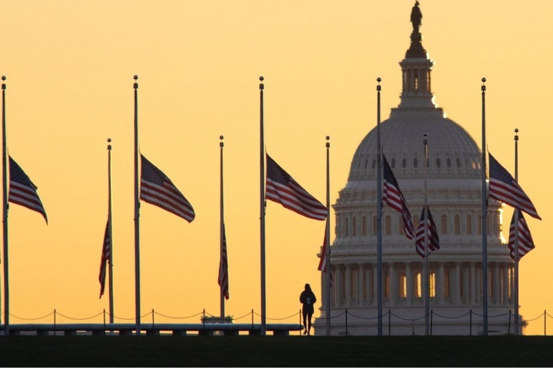 <p>American flags surrounding the Washington Monument fly at half-staff on October 19, 2021, in honor of Colin Powell. </p>