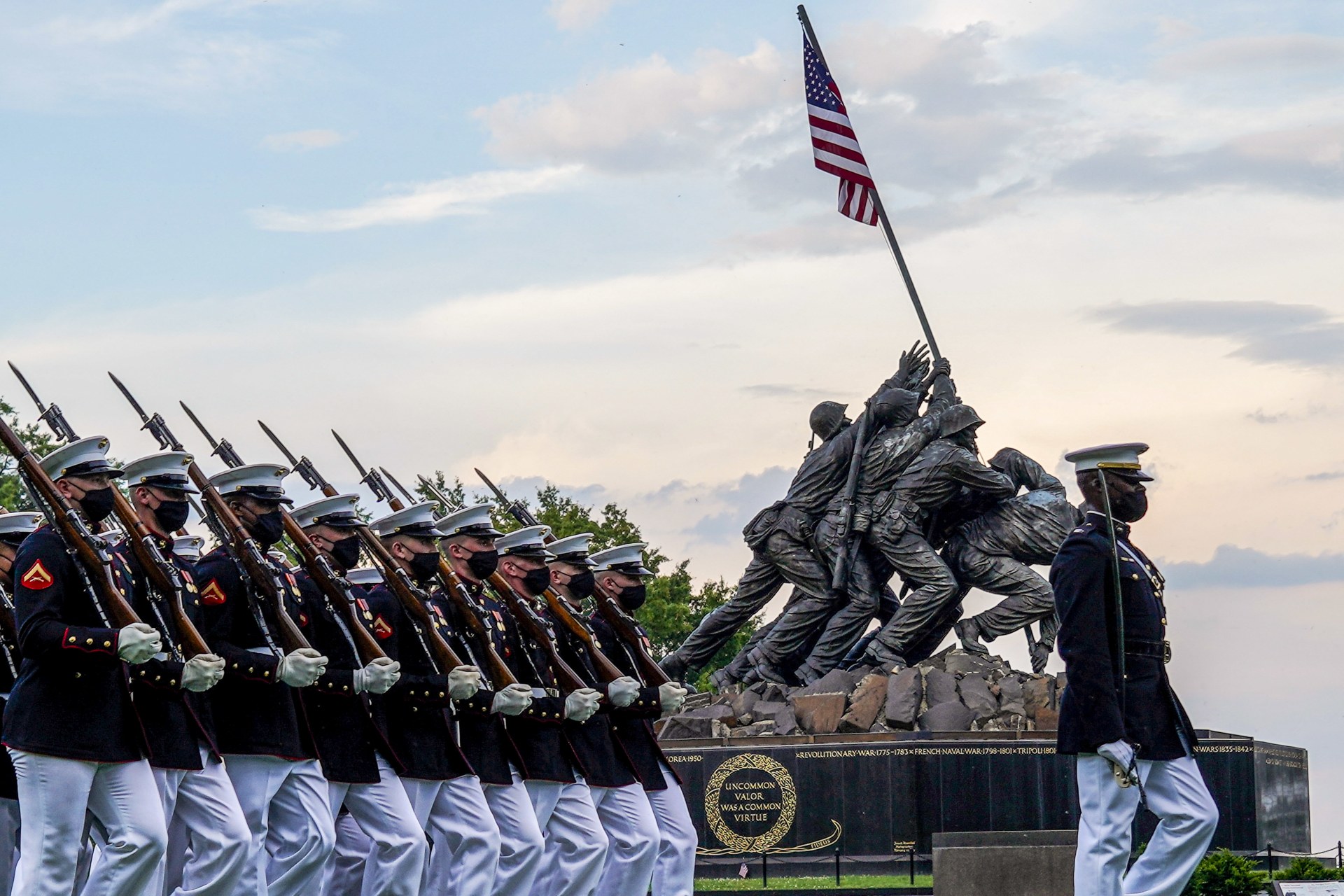 <p>Marines part of the Silent Drill Platoon march in front of the Marine Corps War Memorial in Arlington, Virginia on June 9. 2021. </p>
