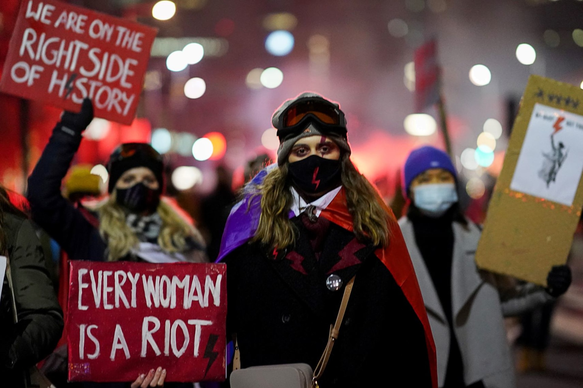 <p>Demonstrators takes part in a protest against the verdict restricting abortion rights in Warsaw in January 2021.</p>
