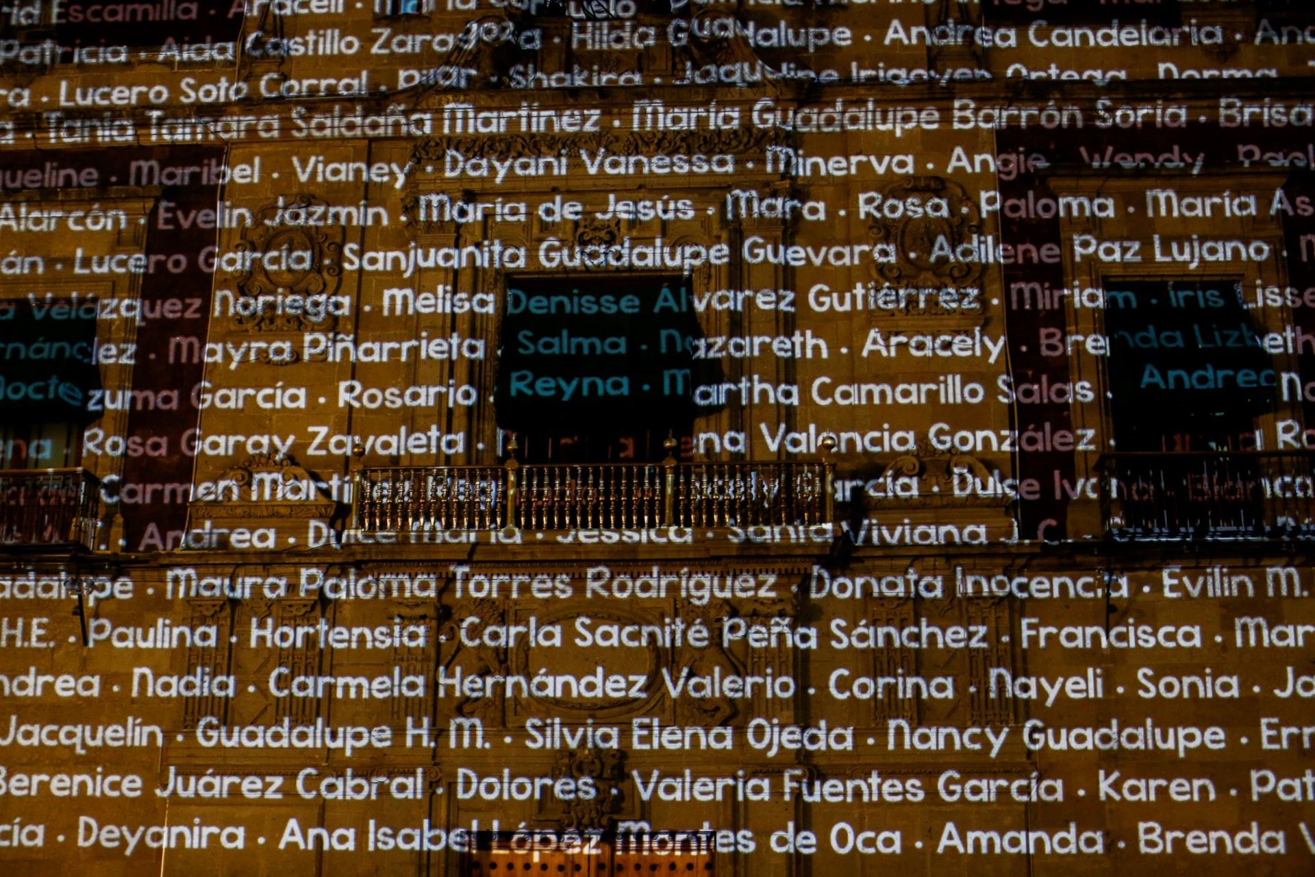 <p>During a protest led by family members of femicide victims in Mexico, the names of murdered women are projected on the National Palace. </p>