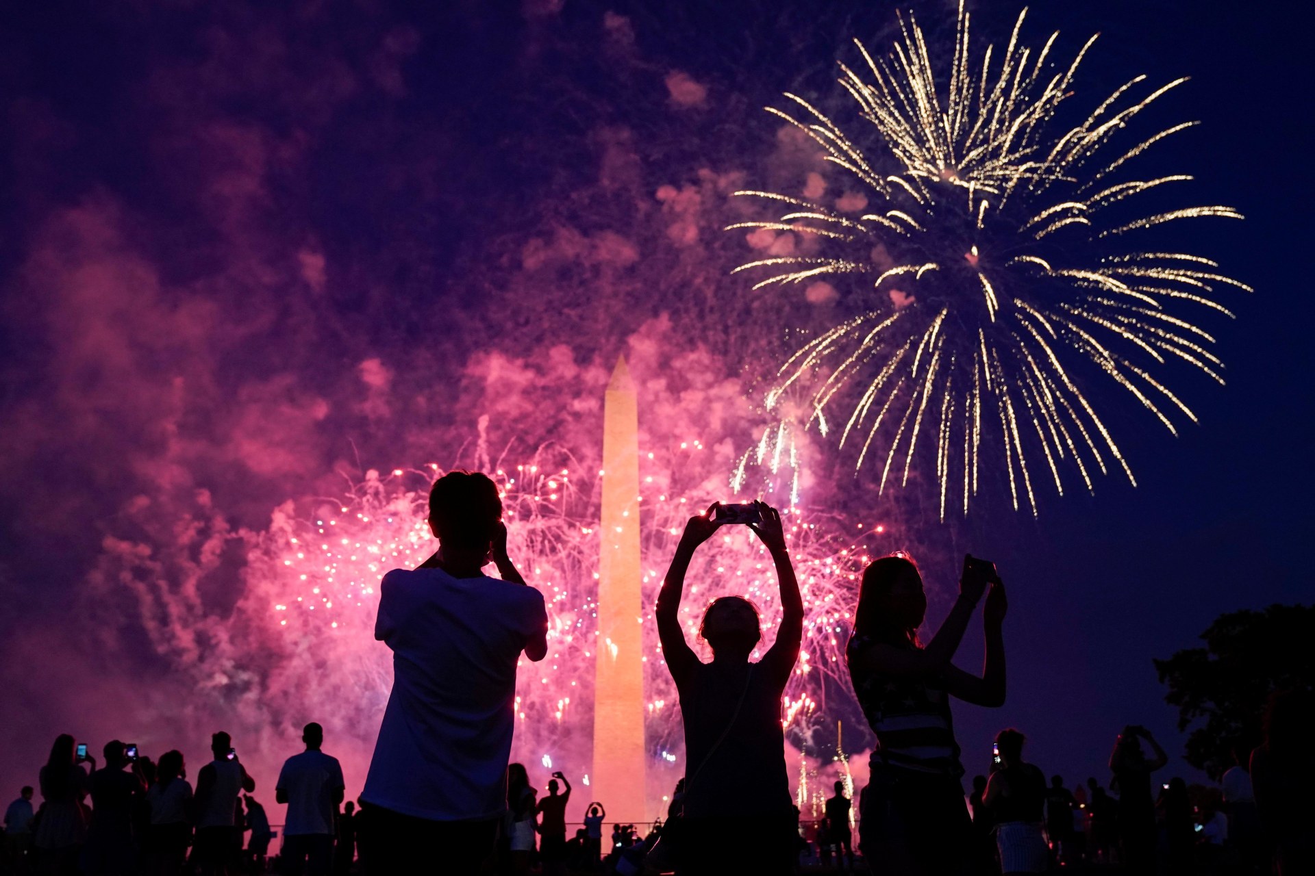 <p>Spectators watching fireworks at the Washington Monument on July 4, 2020.</p>