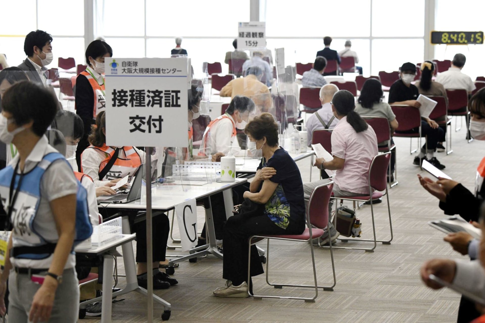 <p>Senior citizens wait to receive a coronavirus disease (COVID-19) vaccine at a large-scale coronavirus disease (COVID-19) vaccination centre in Osaka, western Japan May 24, 2021, in this photo distributed by Kyodo</p>