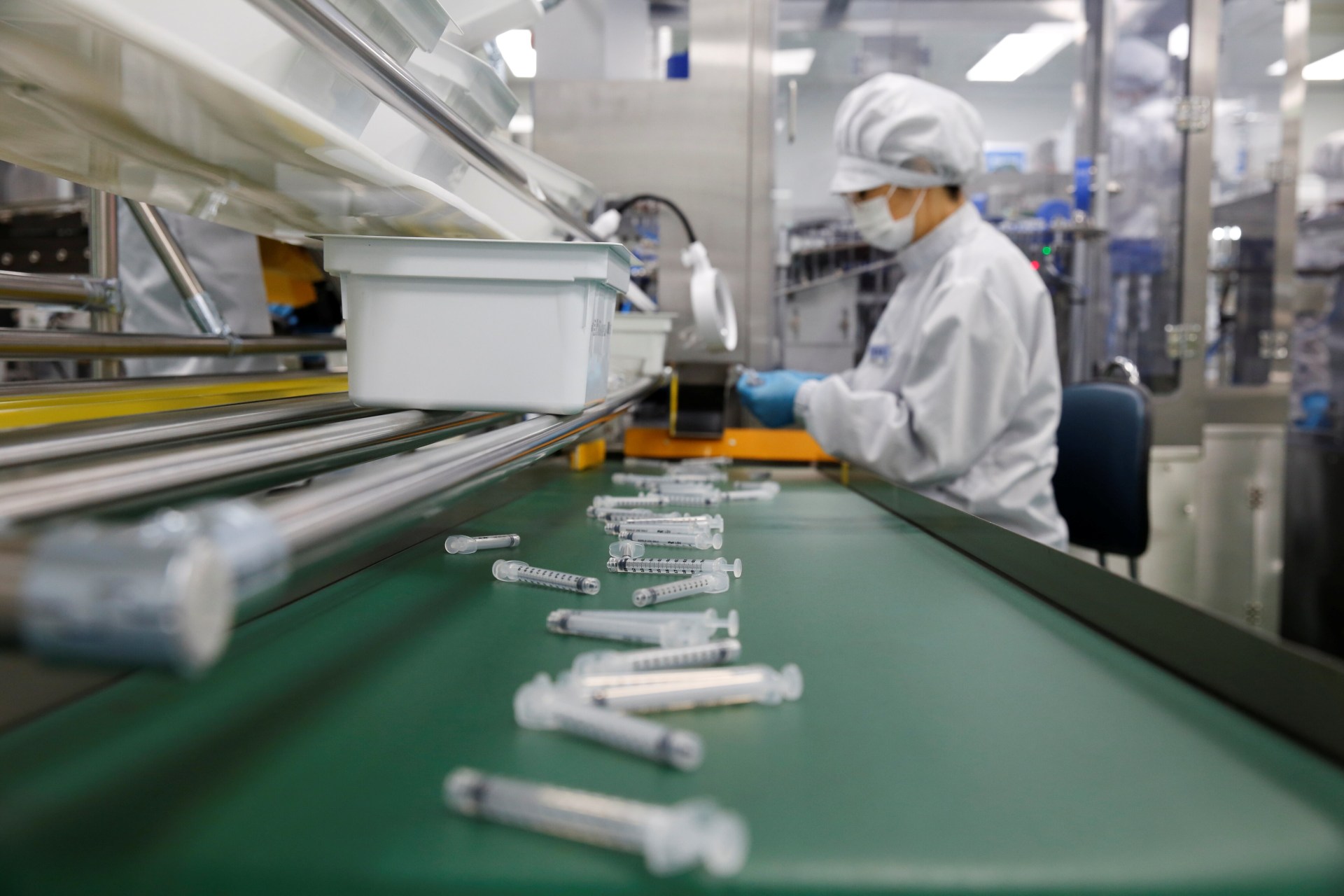 <p>An employee works at a syringe factory in Gunsan, South Korea, on April 5, 2021. </p>
