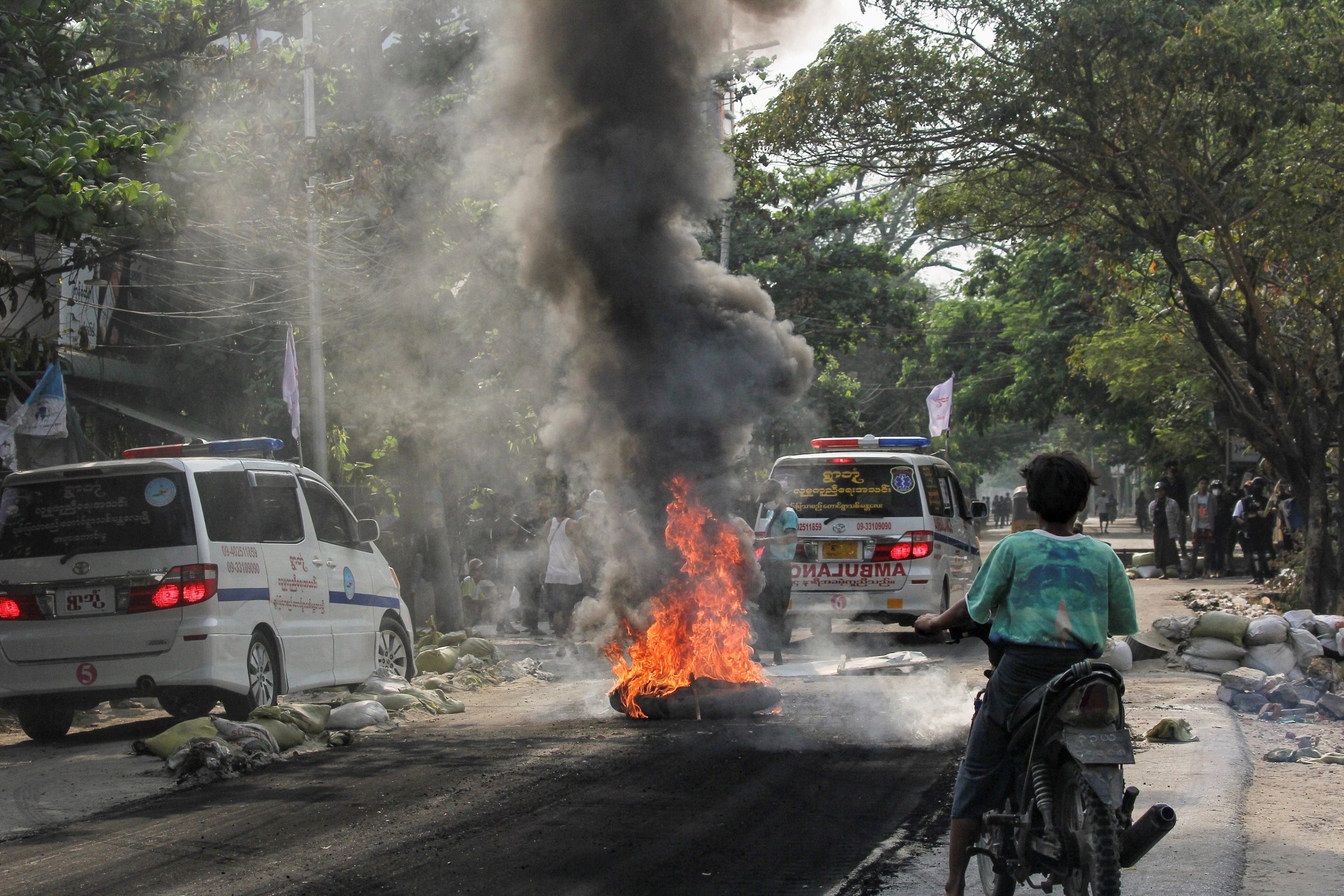 <p>A fire burns on the street during a protest against the military coup, in Mandalay, Myanmar on April 1, 2021.</p>