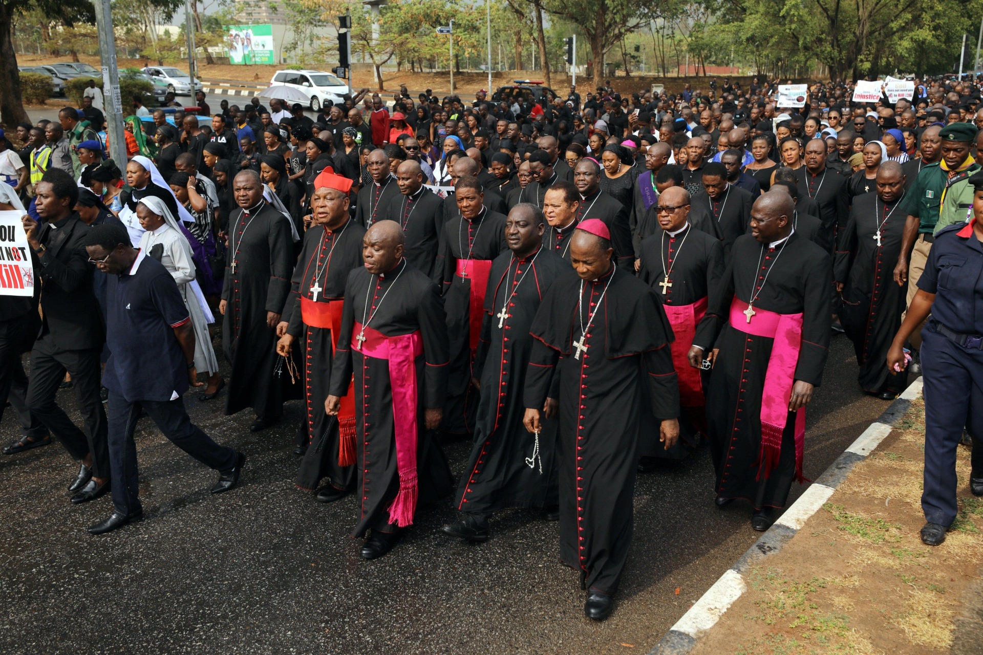 <p>Catholic faithfuls, led by bishops, march during a protest over unending killings of Nigerians in Abuja, Nigeria on March 1, 2020.</p>
