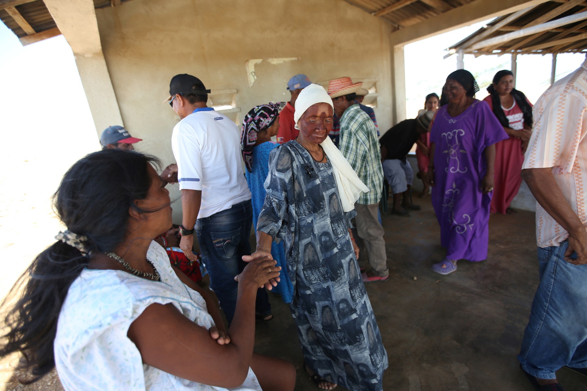 <p>A Venezuelan indigenous women from the Wayuu tribe shake hands during a reconciliation ceremony, in Castilletes, Colombia February 19, 2020. Picture taken February 19, 2020. REUTERS/Luisa Gonzalez</p>