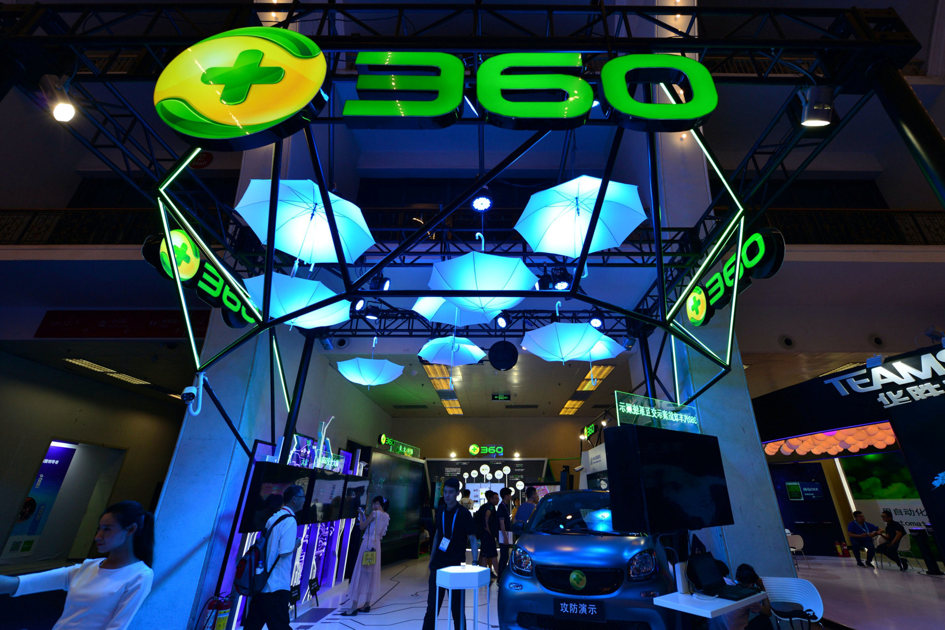 <p>Visitors are seen at the booth of anti-virus software maker Qihoo 360 at the China International Software Expo in Beijing on June 29, 2018.</p>