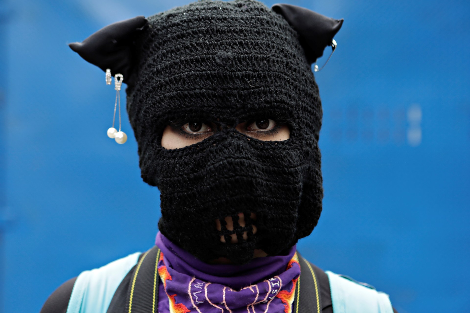 <p>A masked woman participates in a march to demand justice for victims of gender-based violence and femicides in Mexico City, Mexico. August 16, 2020.</p>
