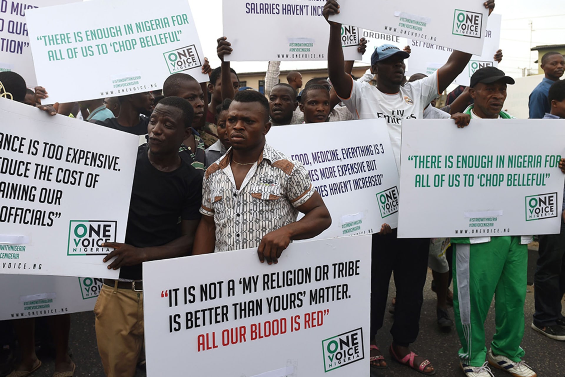 <p>Protesters hold placards during an anti-government demonstration in Lagos, on February 6, 2017, to protest against the prevailing economic hardship, high cost of living, and the government’s handling of the economic crisis in the country.</p>