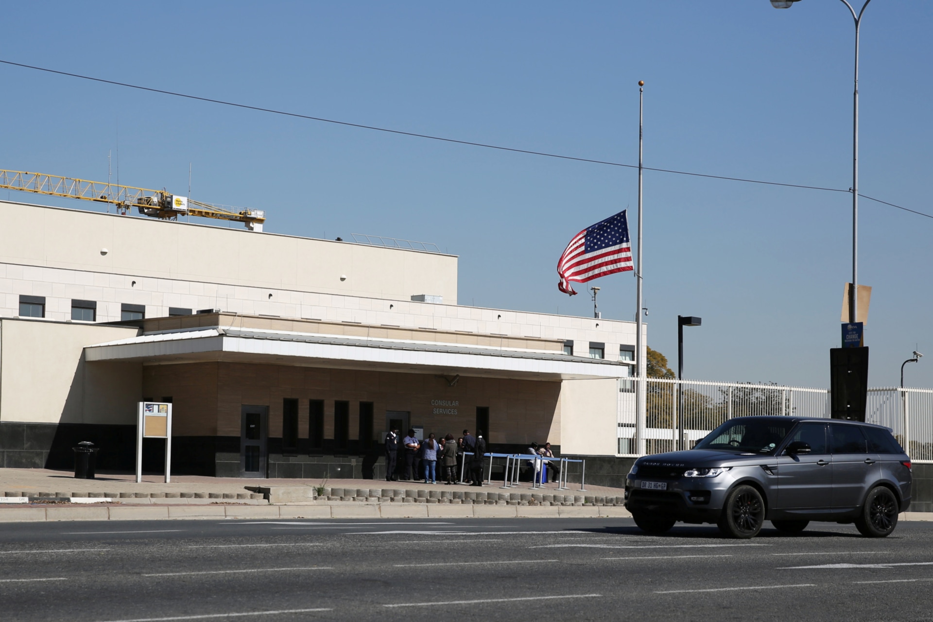 <p>A car drives past the U.S. Embassy in Sandton, South Africa, on July 12, 2016.</p>