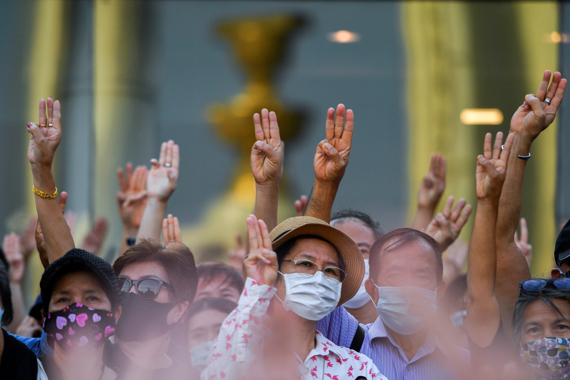 <p>Protesters raise their hands during a protest demanding the resignation of the government, defying the coronavirus disease (COVID-19) restrictions on large gatherings in one of the largest demonstrations since a 2014 army coup in Bangkok, Thailand on July</p>