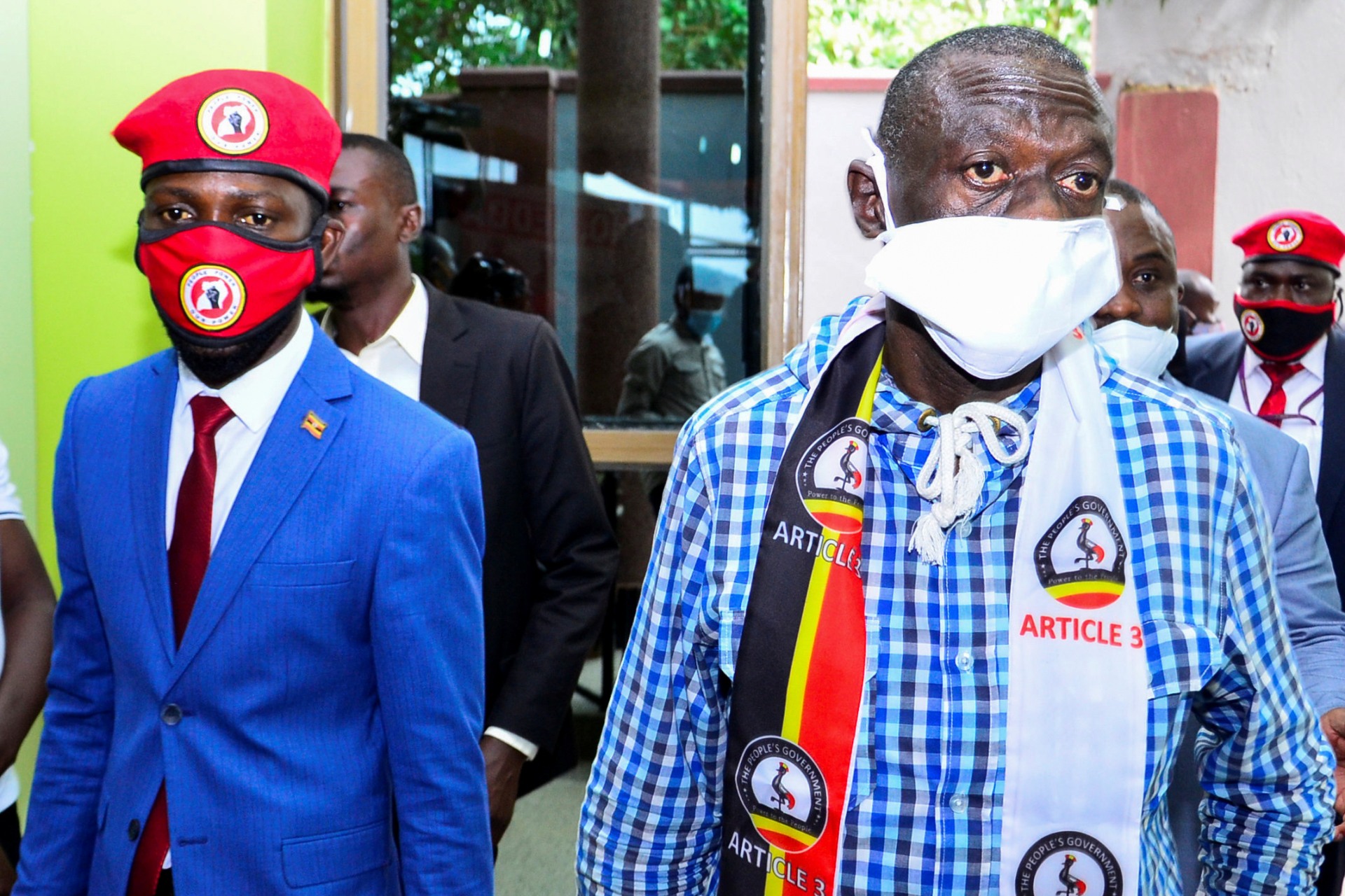 <p>Ugandan opposition figures Bobi Wine and Kizza Besigye arrive for a joint news conference to discuss the government’s handling of the pandemic and a possible alliance against President Yoweri Museveni in upcoming elections, Kampala, Uganda June 15, 2020</p>