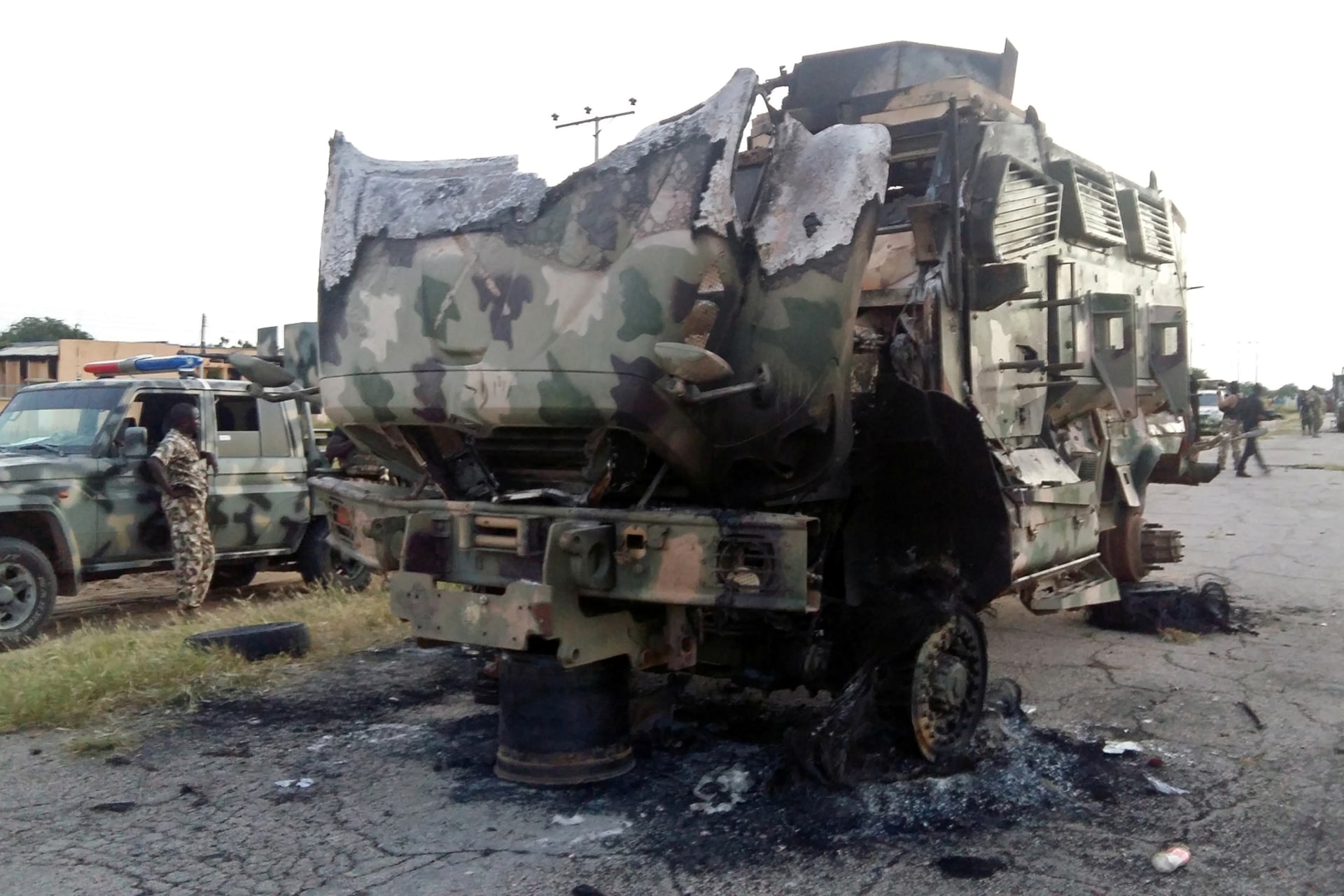 <p>A damaged military vehicle is pictured in the northeast town of Gudumbali, after an attack by members of Islamic State in West Africa (ISWA), Nigeria September 11, 2018.</p>