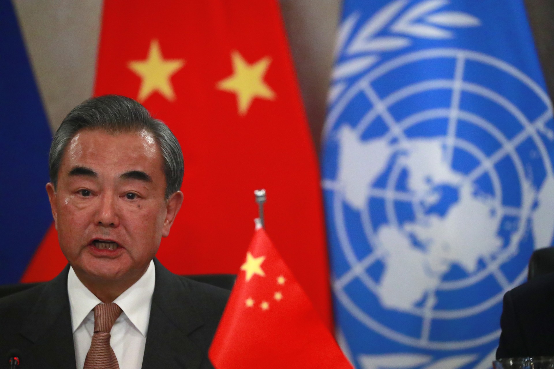 <p>Chinese Foreign Minister Wang Yi speaks while hosting a lunch with his counterparts of the permanent five veto-wielding members of the UN Security Council in New York on September 26, 2019.</p>
