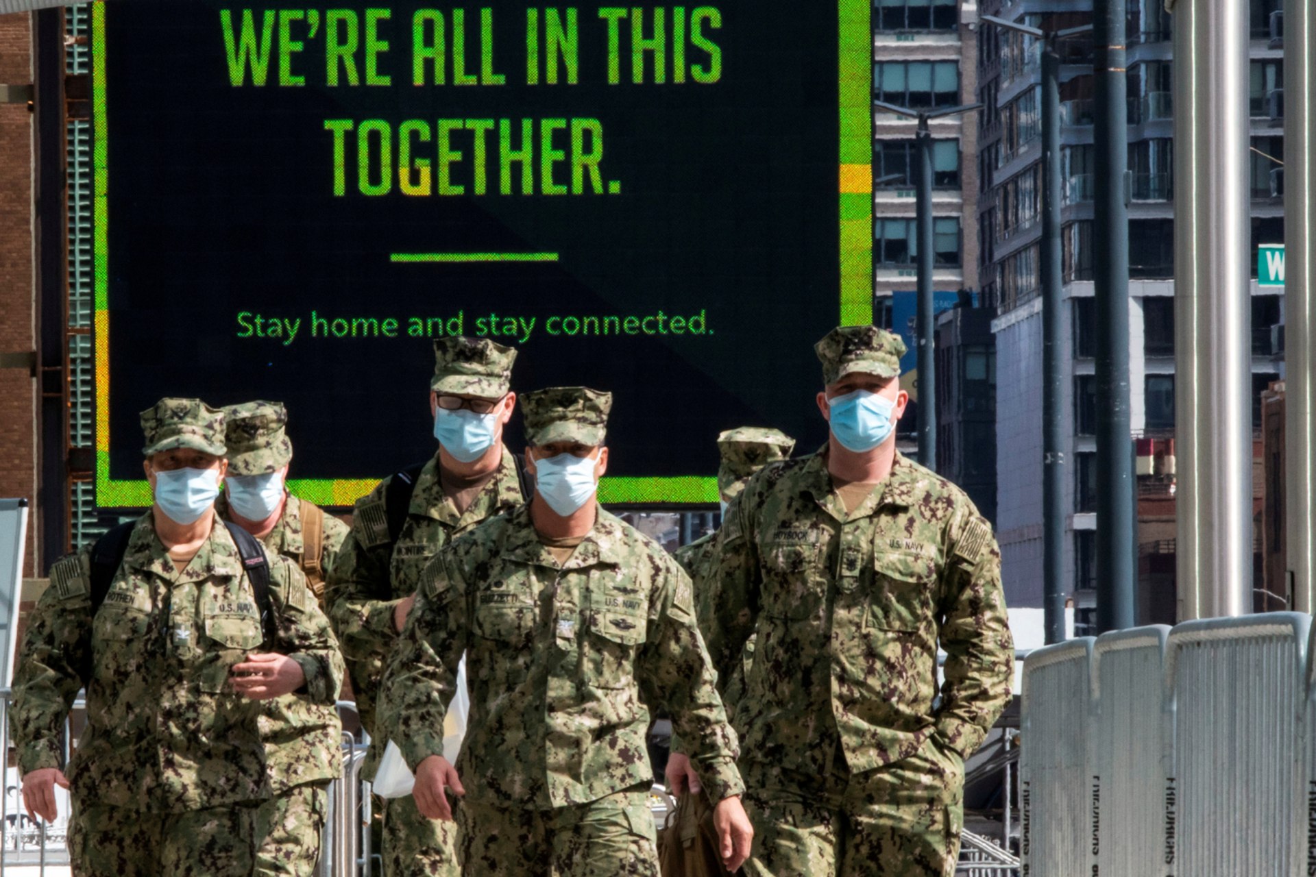 <p>U.S. military personnel wearing face masks arrive at the Jacob K. Javits Convention Center in New York on April 7, 2020.</p>
