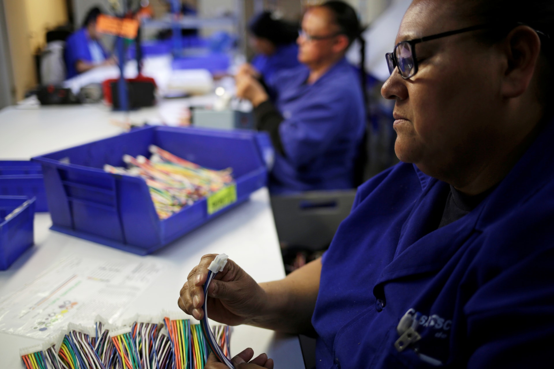 <p>Operators work at a wire harness and cable manufacturing plant as the fast-spreading coronavirus outbreak has rippled through the global economy and upended supply chains, in Ciudad Juarez, Mexico March 11, 2020. </p>
