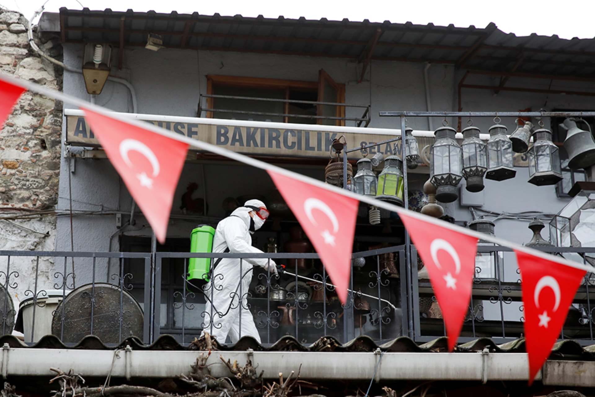 <p>A worker in a protective suit sprays disinfectant at the Grand Bazaar, known as the Covered Bazaar, to prevent the spread of the coronavirus, in Istanbul, Turkey.</p>