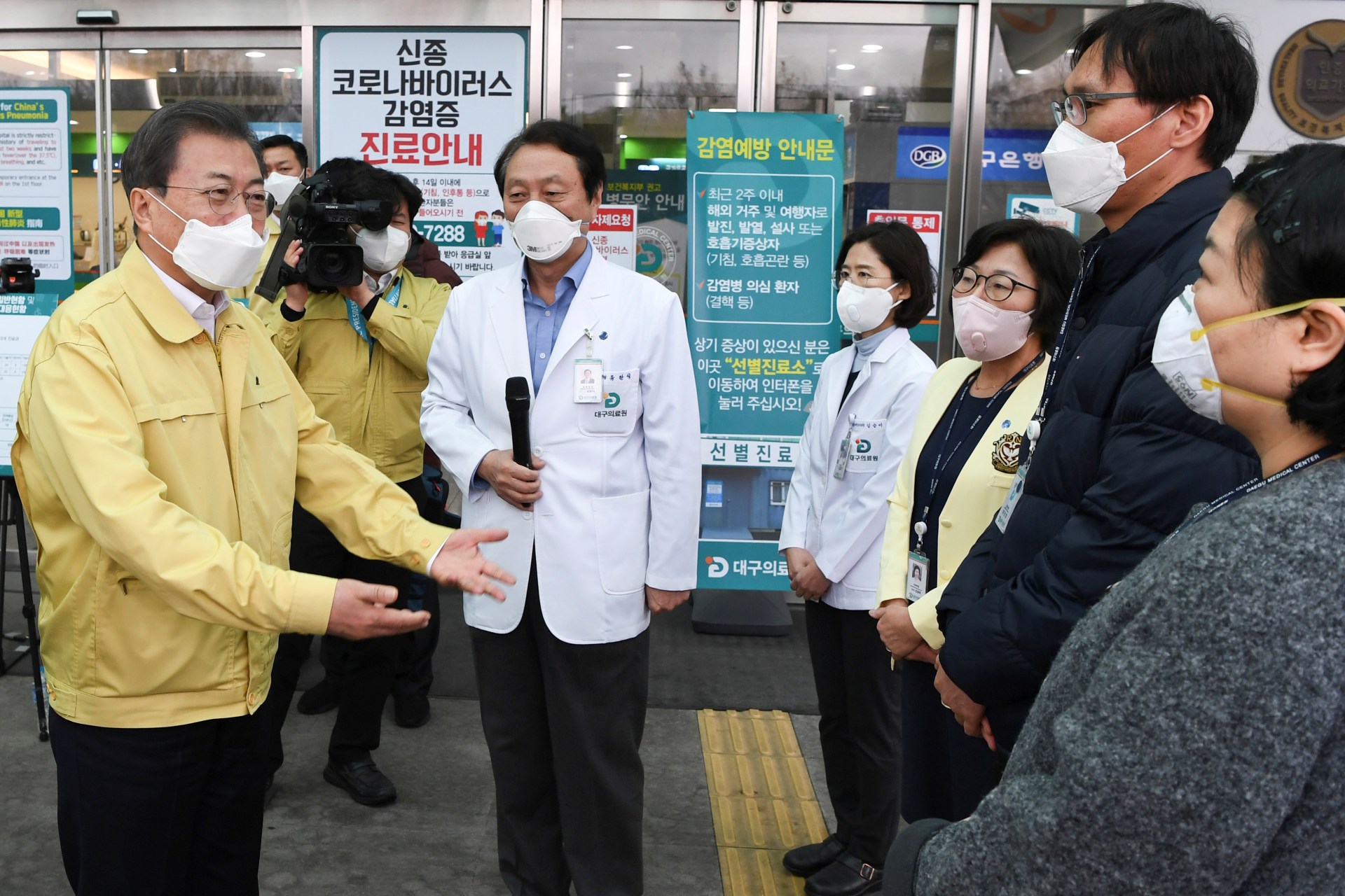 <p>South Korea’s President Moon Jae-in gets briefed during his visit to a medical center in Daegu, South Korea, on February 25, 2020.</p>
