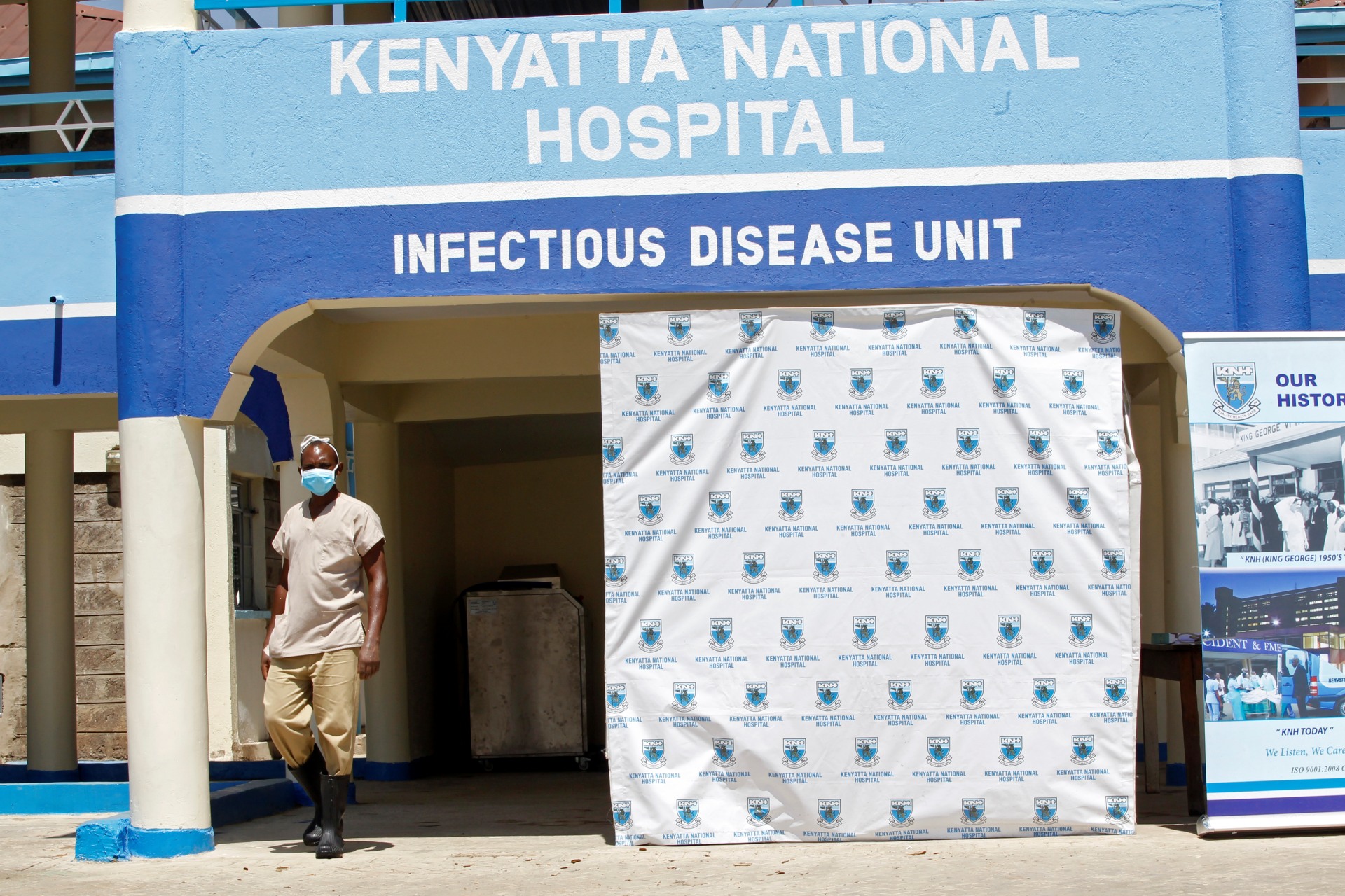 <p>A worker walks outside the coronavirus isolation facility at the Mbagathi Hospital in Nairobi, Kenya, on March 15, 2020. </p>