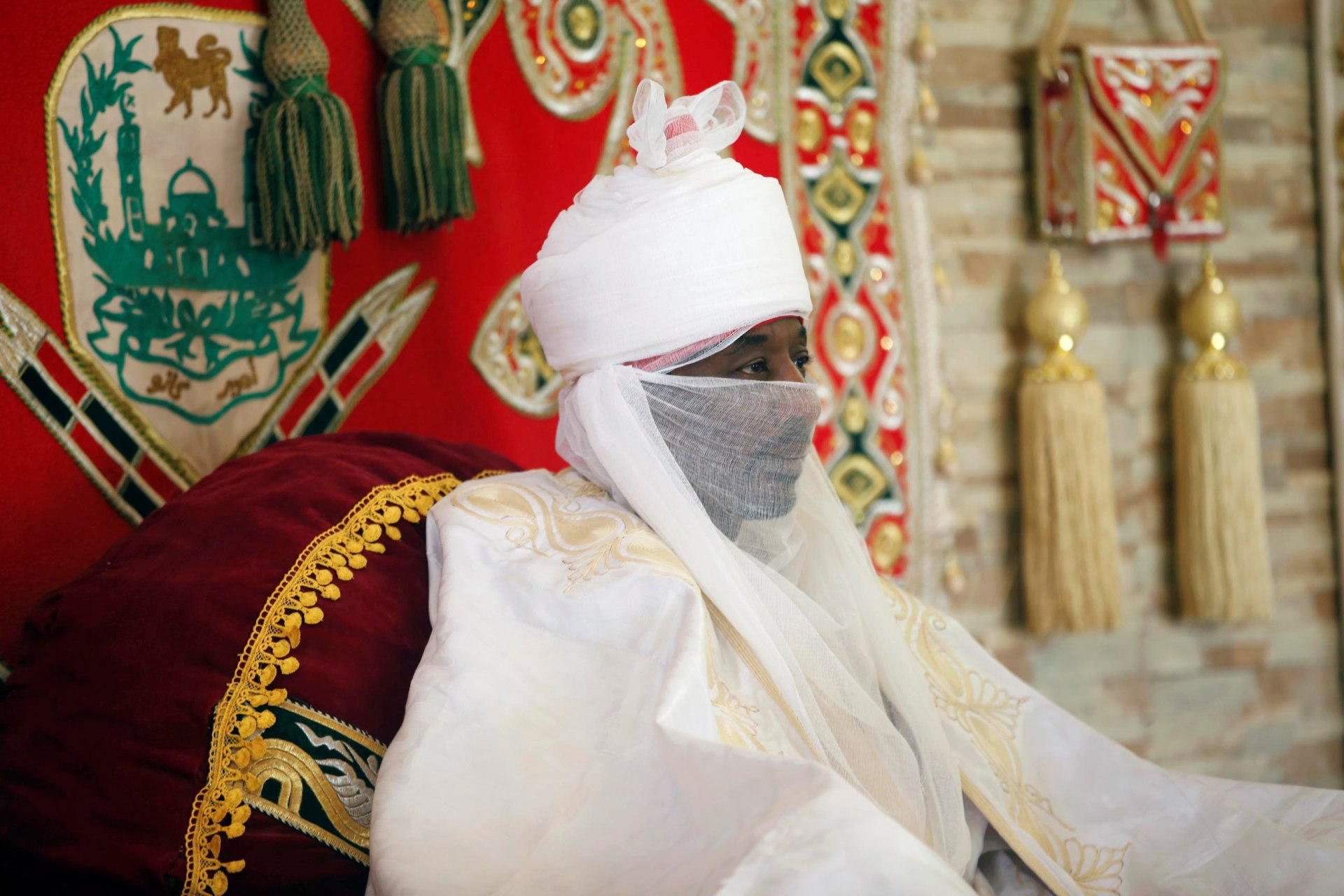 <p>Emir of Kano at the time, Muhammad Lamido Sanusi II watches as local chiefs pay traditional homage, a day before the end of holy month of Ramadan, in Nigeria’s northern city of Kano, July 5, 2016.</p>

