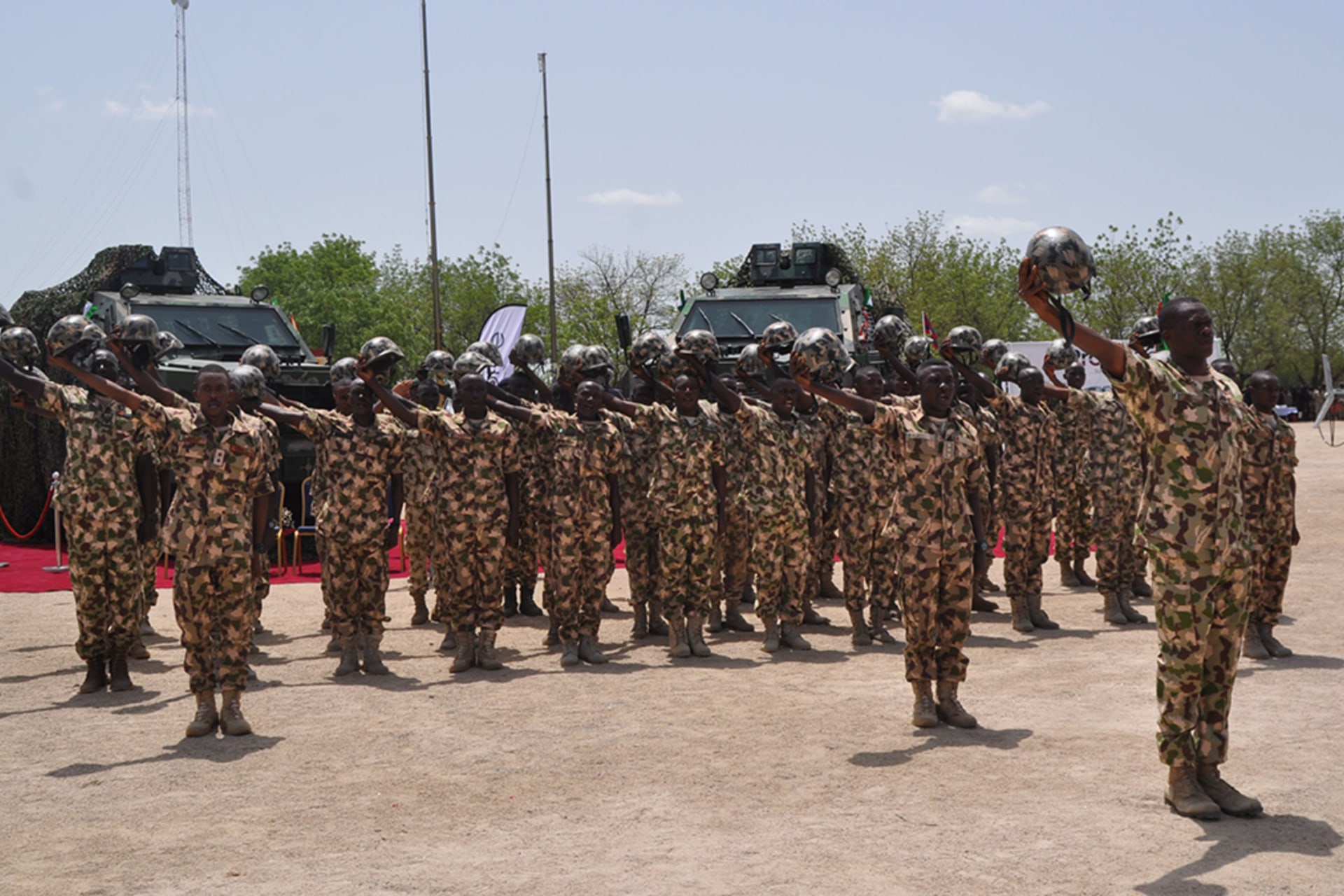 <p>Nigerian soldiers salute during a visit by President in Maiduguri, on July 6, 2018, during the celebrations for Nigeria Army day. </p>
