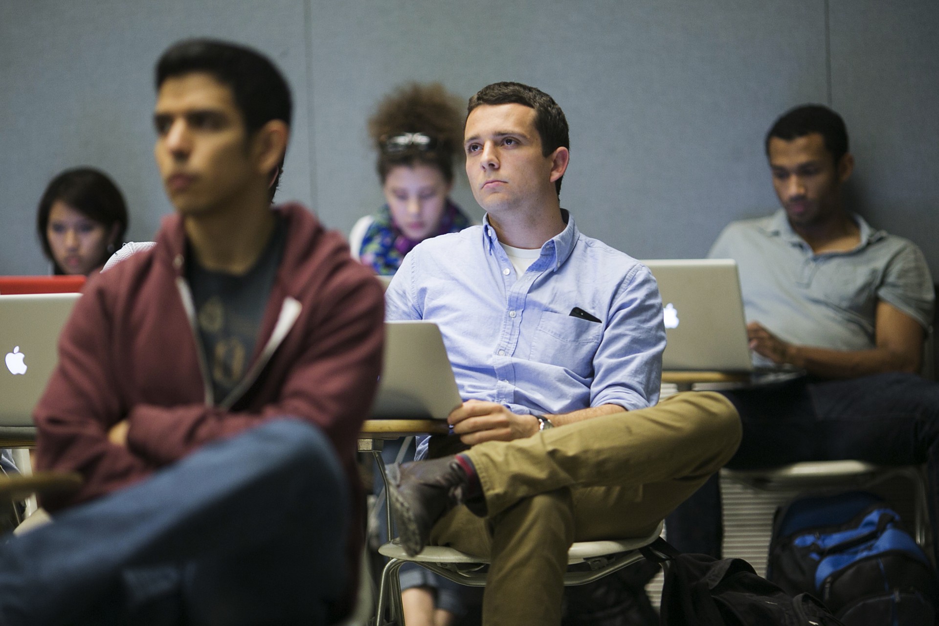 <p>Stanford University students listen while classmates make a presentation</p>