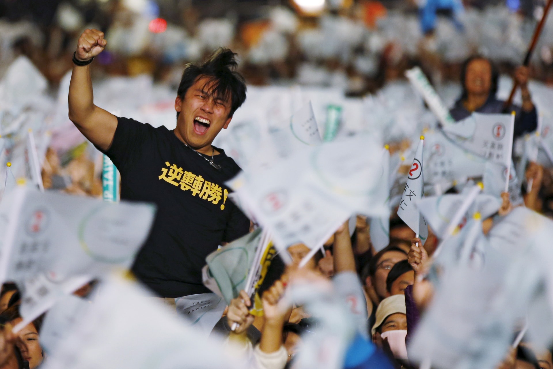 <p>A supporter of Democratic Progressive Party (DPP) Chairperson and presidential candidate Tsai Ing-wen celebrates to preliminary results at their party headquarters in Taipei, Taiwan</p>
